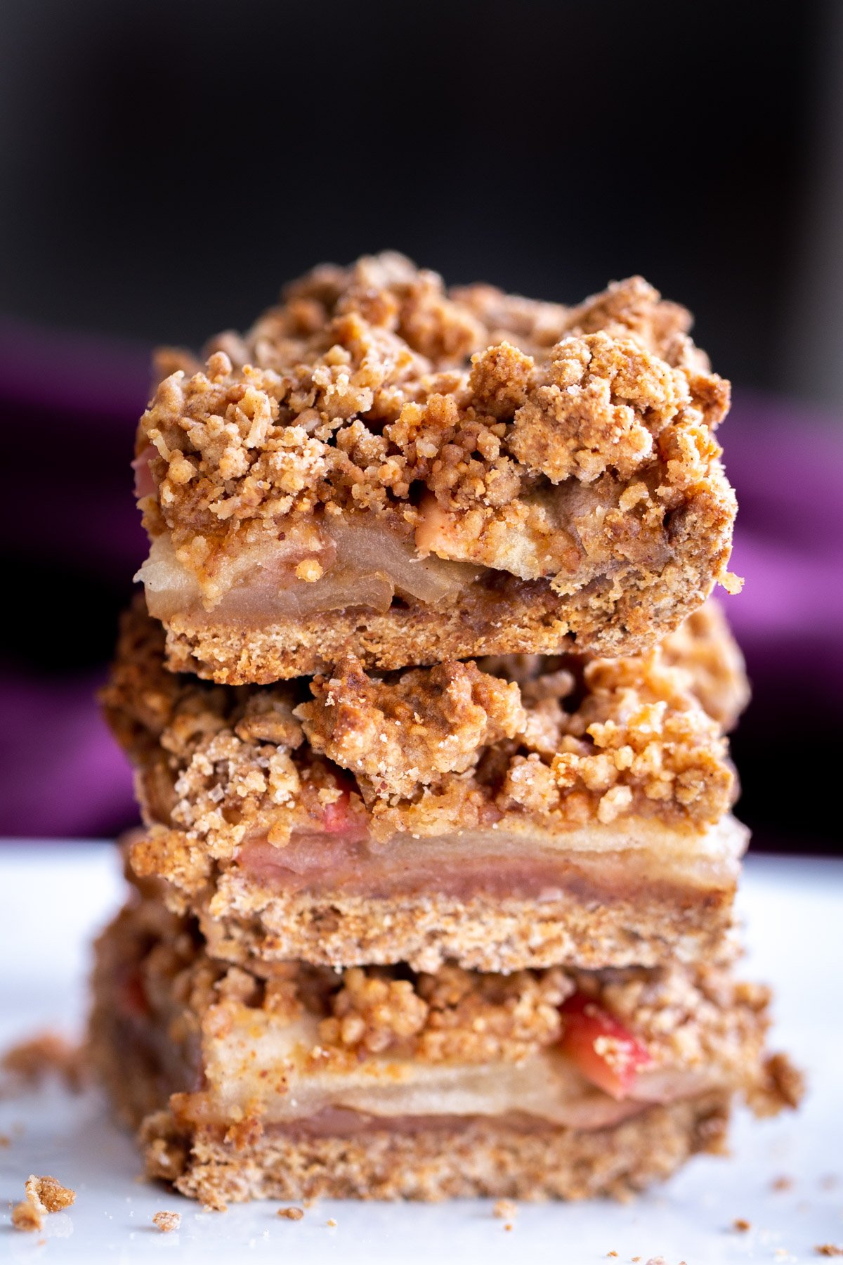 a stack of vegan apple pie crumble bars