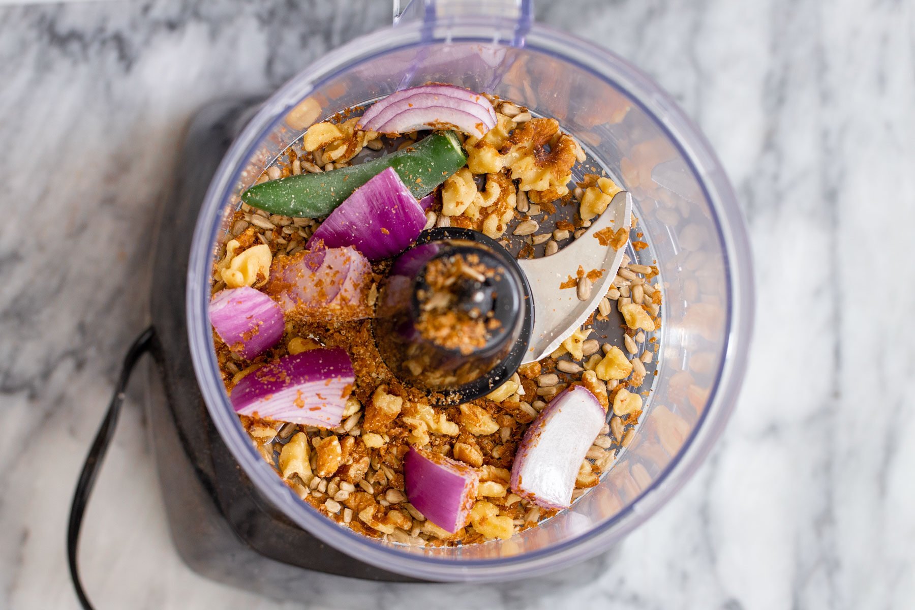 ingredients for vegan cauliflower taco meat in a food processor