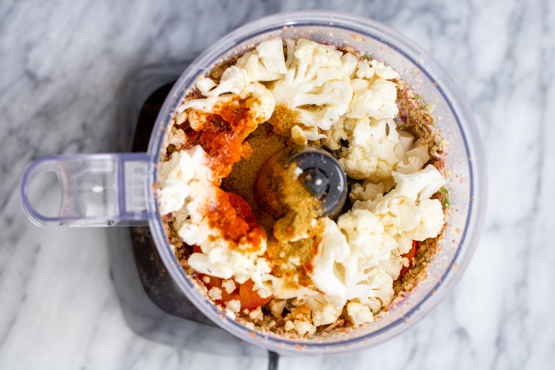 cauliflower and more taco meat ingredients in a small food processor