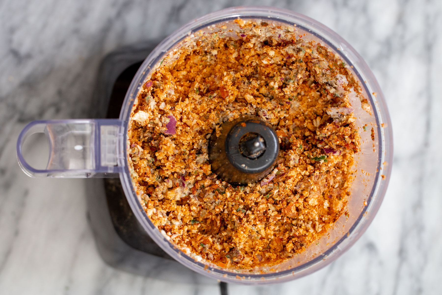 a small food processor filled with cauliflower taco meat
