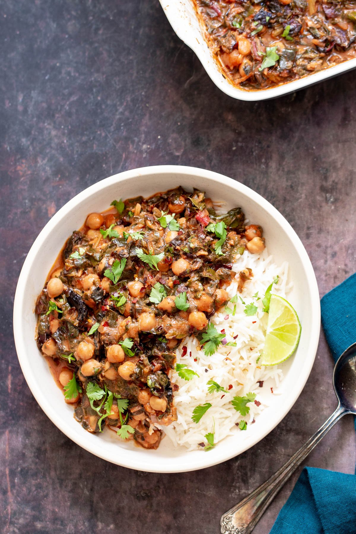 a serving of spinach chickpea curry served over rice