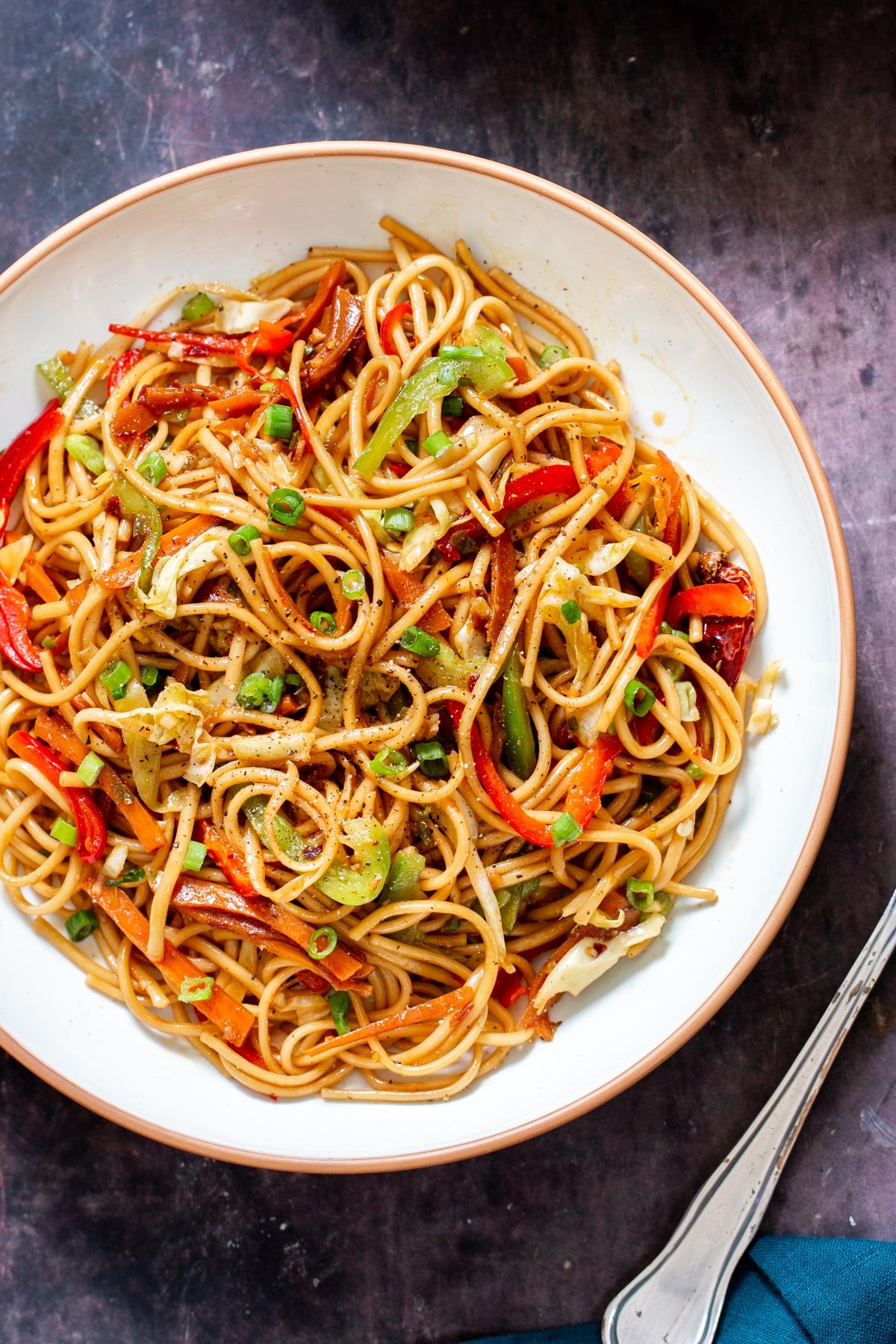 Indo Chinese Chili Garlic Noodles topped with chopped green onion