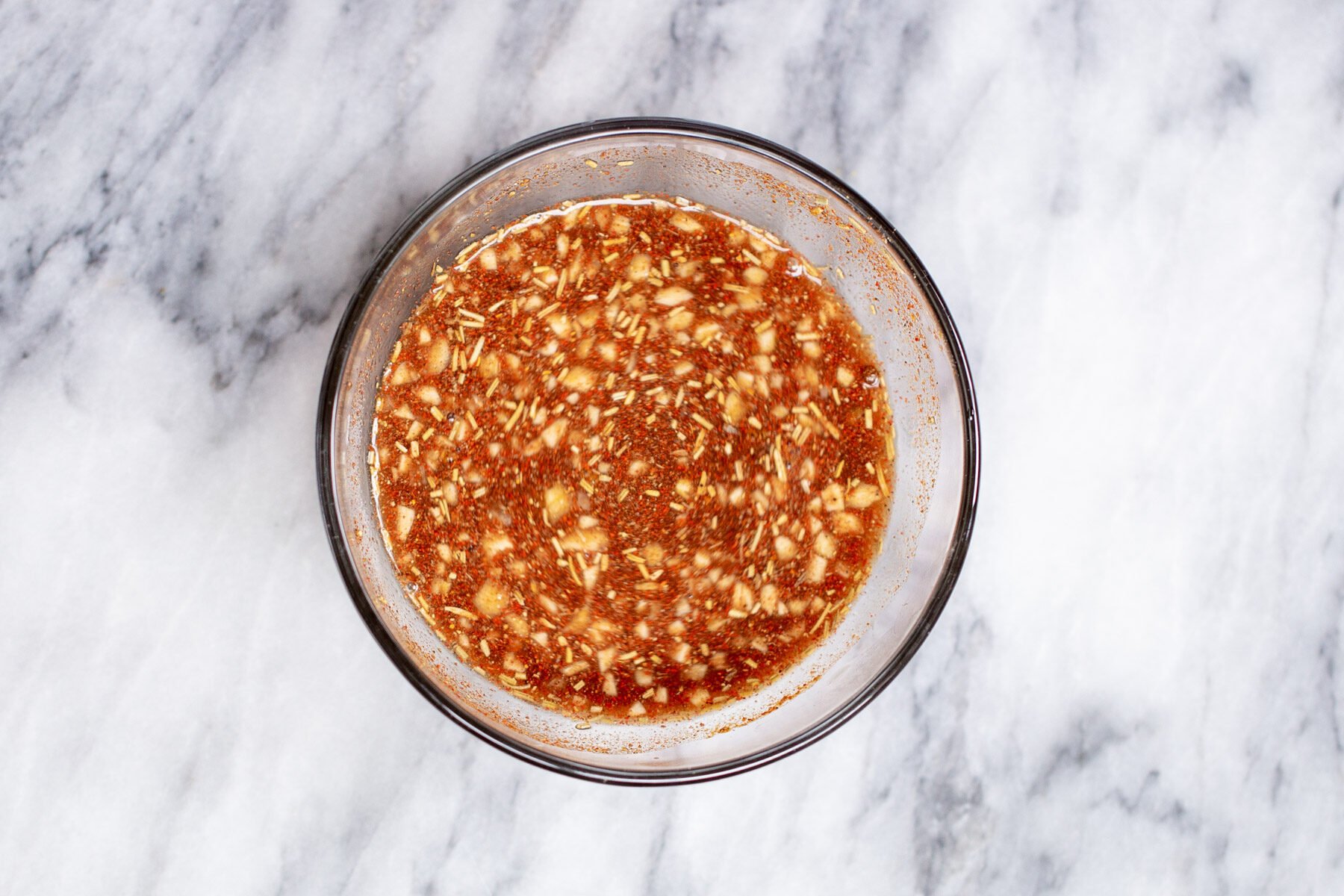 berbere being mixed into water and balsamic vinegar