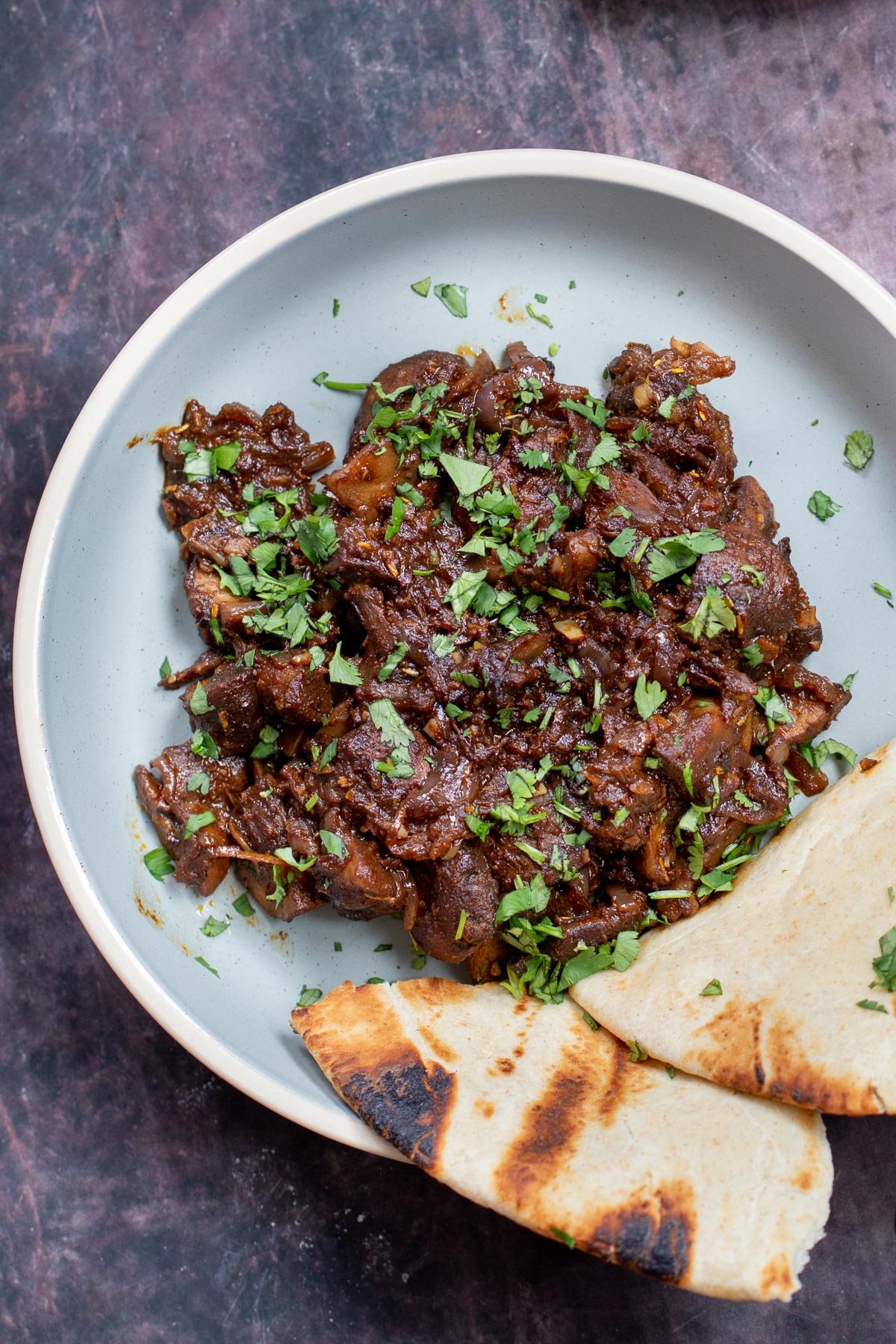 a platter with Ethiopian mushrooms served with a side of flatbread