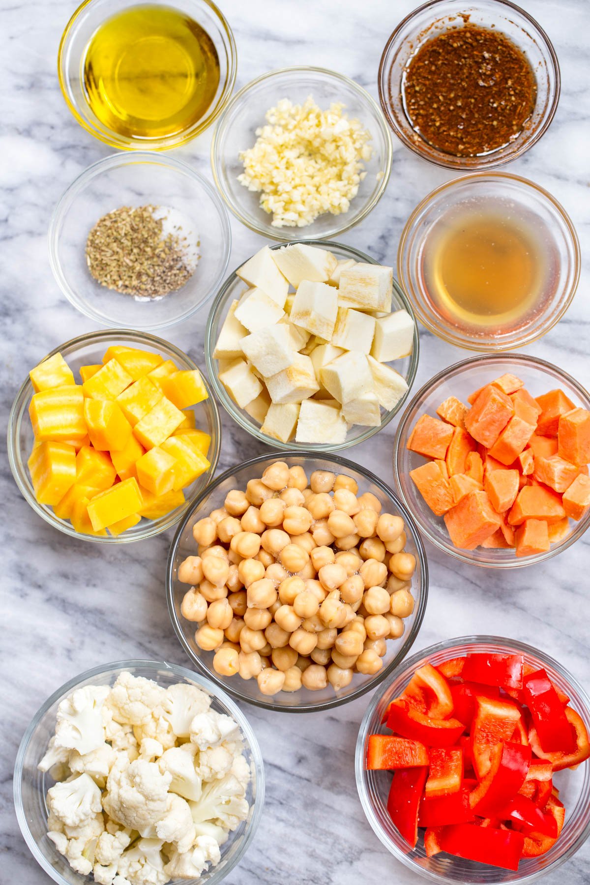 ingredients for roasted root vegetable bowls on a marble countertop