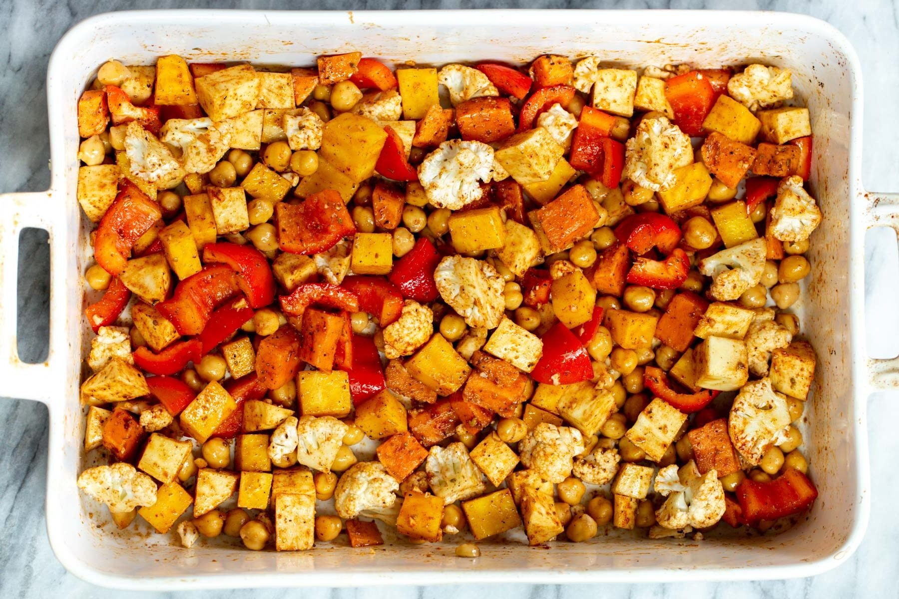 roasted root veggies in a white casserole dish