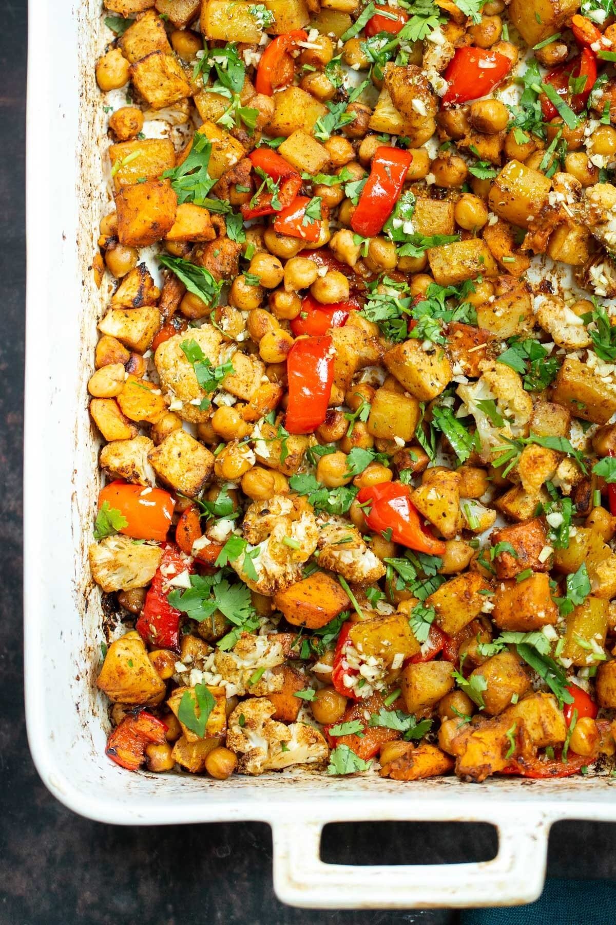 Mediterranean vegetable tray bake sprinkled with cilantro