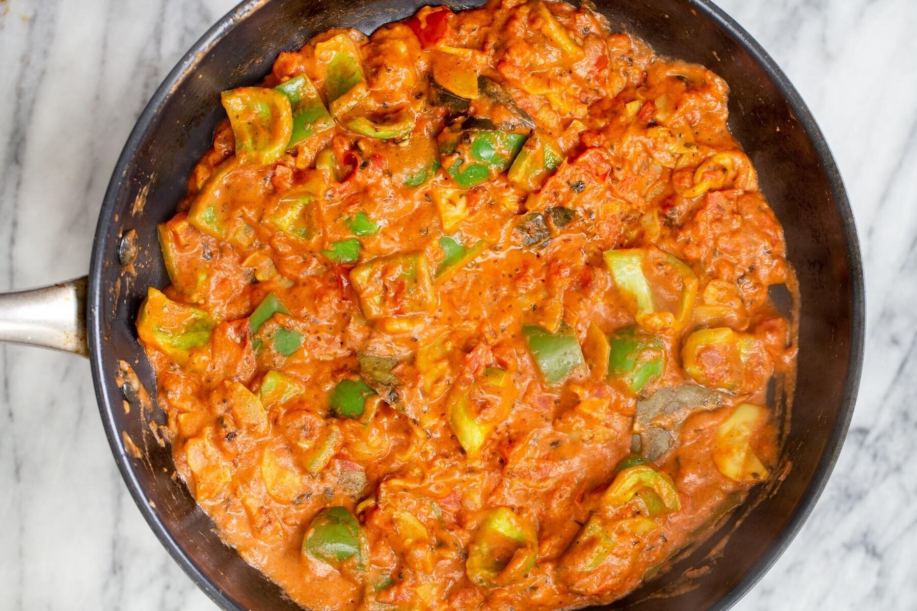 Indian tofu tikka masala in a sauteeing pan