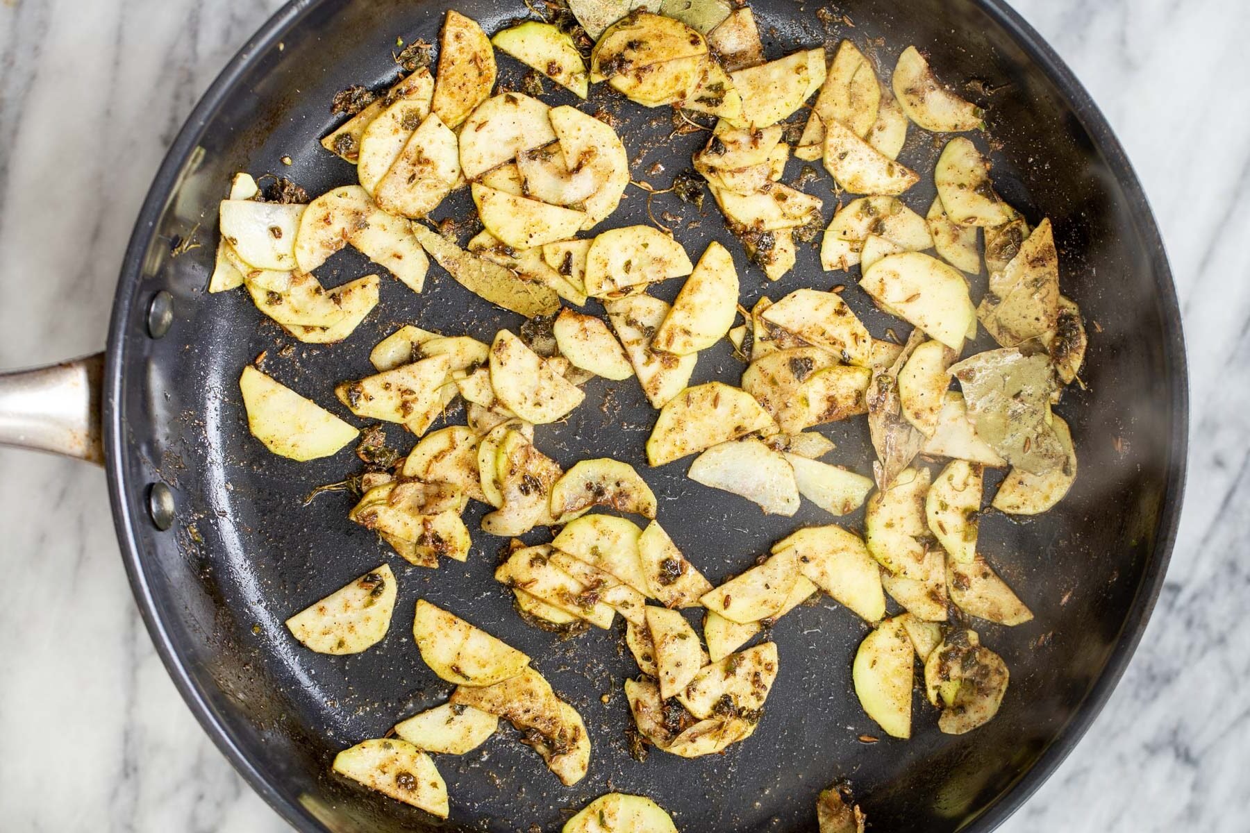 sauteed zucchini in a black skillet