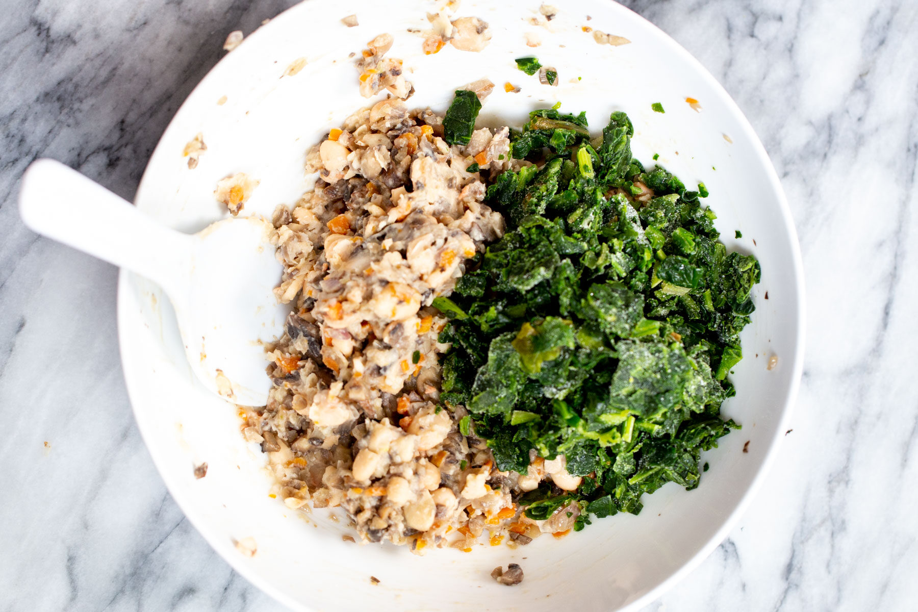 spinach being added to tart filling