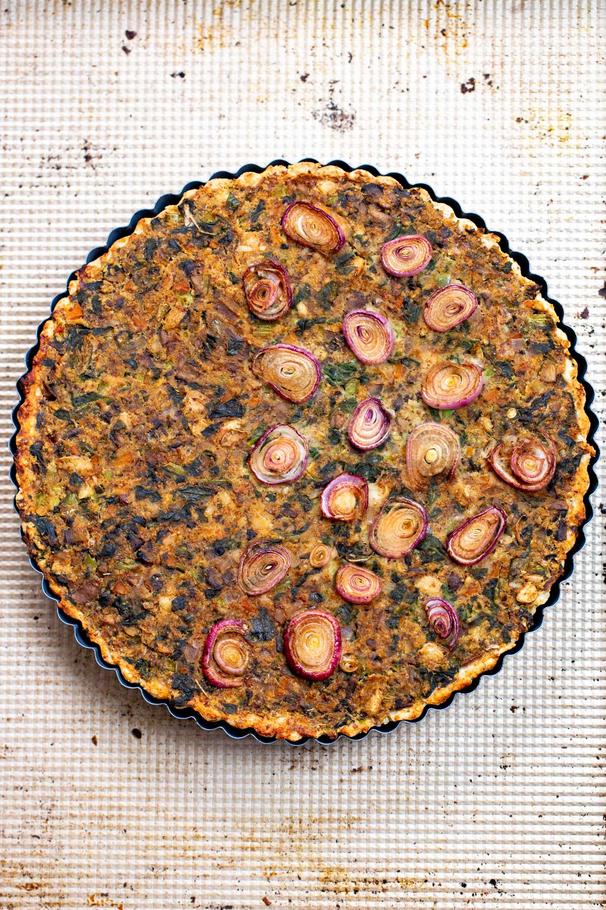 overhead shot of vegan spinach mushroom tart