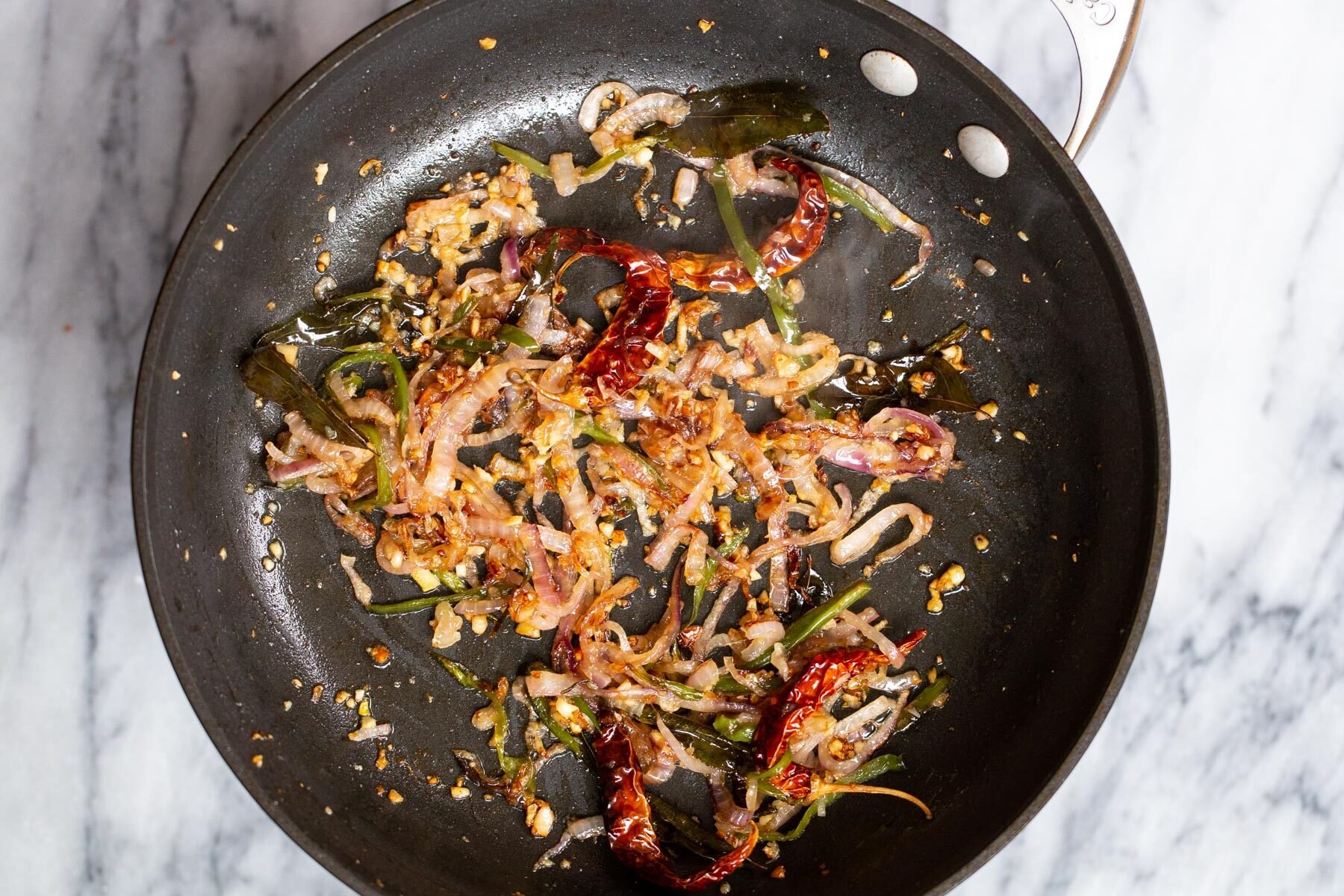 sauteed spices, ginger, onion and garlic in a sauteeing pan