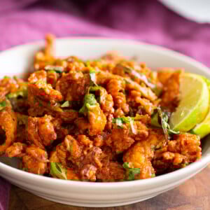 side view of a bowl of vegan chicken kondattam
