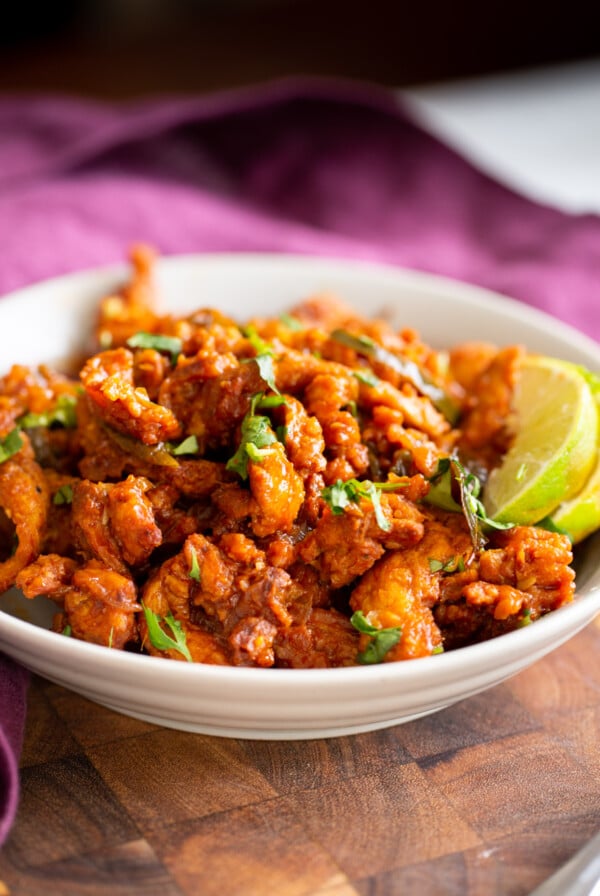 side view of a bowl of vegan chicken kondattam