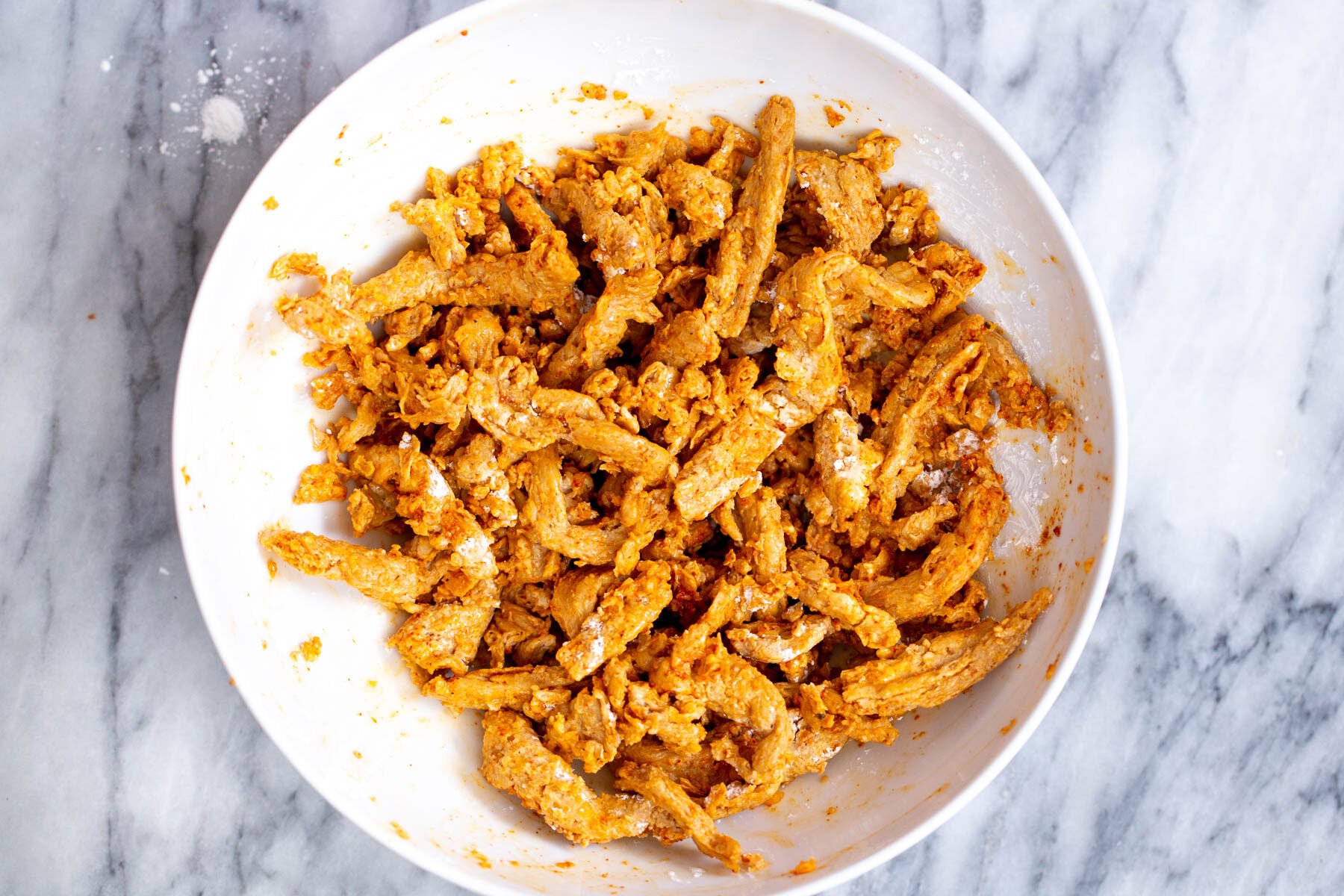 marinated soy curls in a white bowl