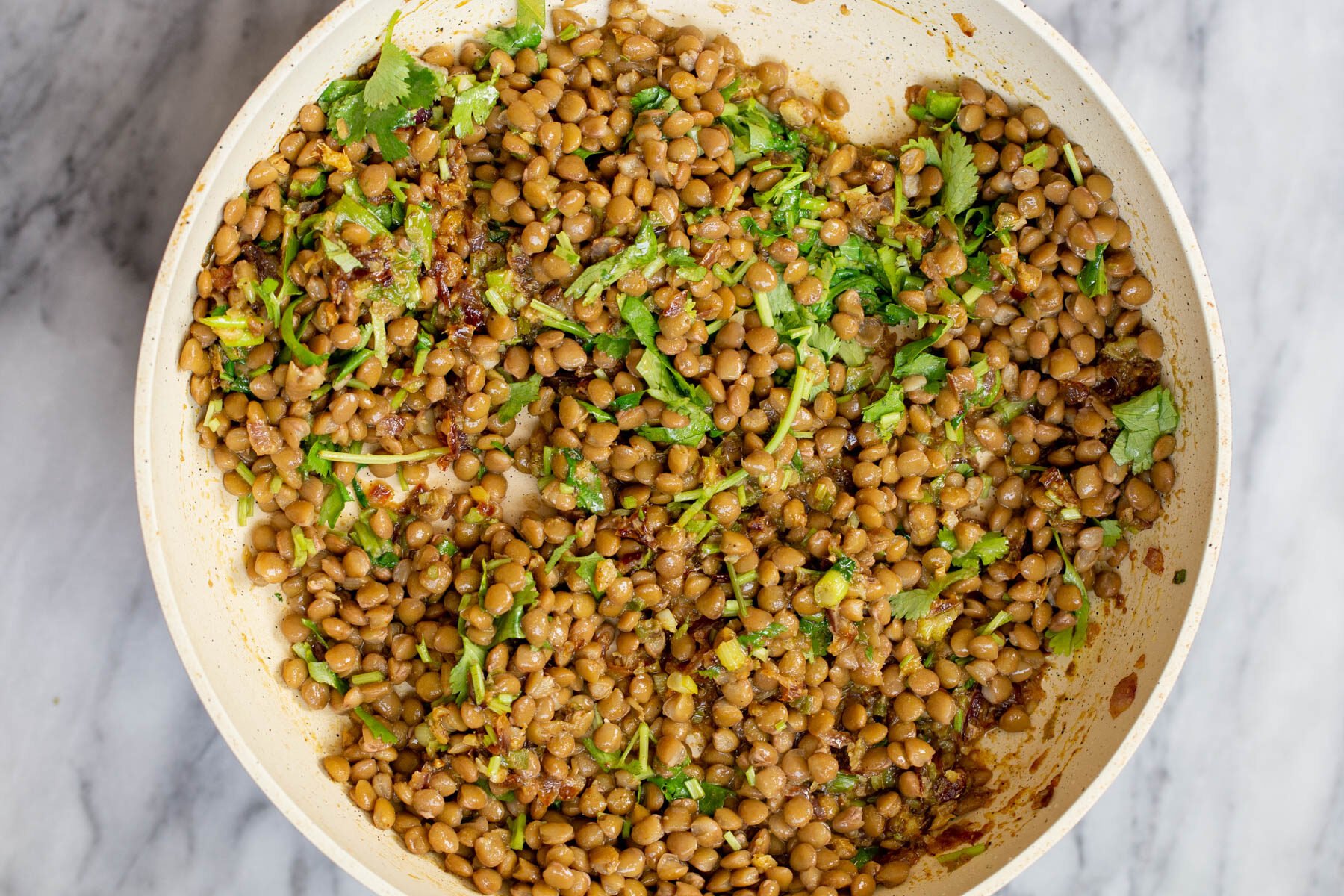 lentil filling for vegan sambusa pie in a white saucepan