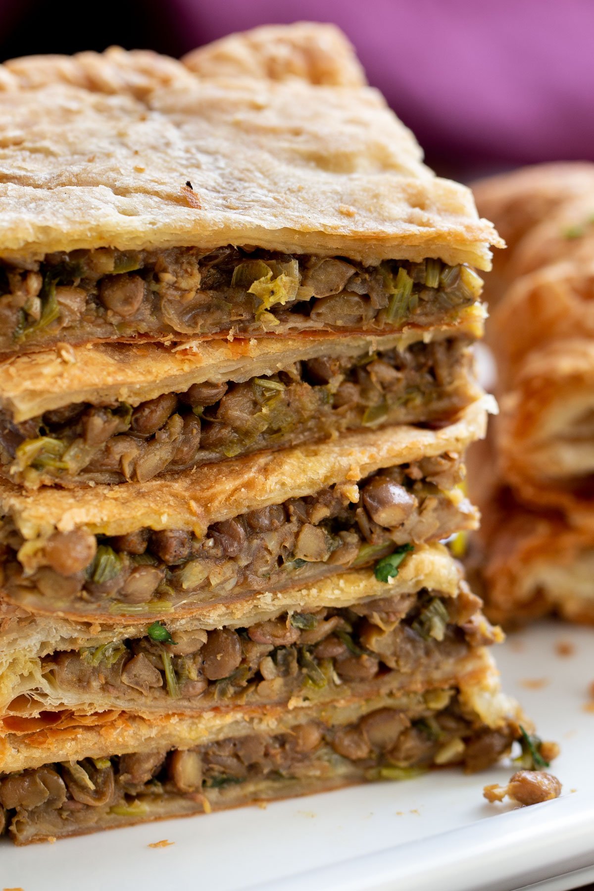 vegan sambusa stacked vegan sambusa on a white plate