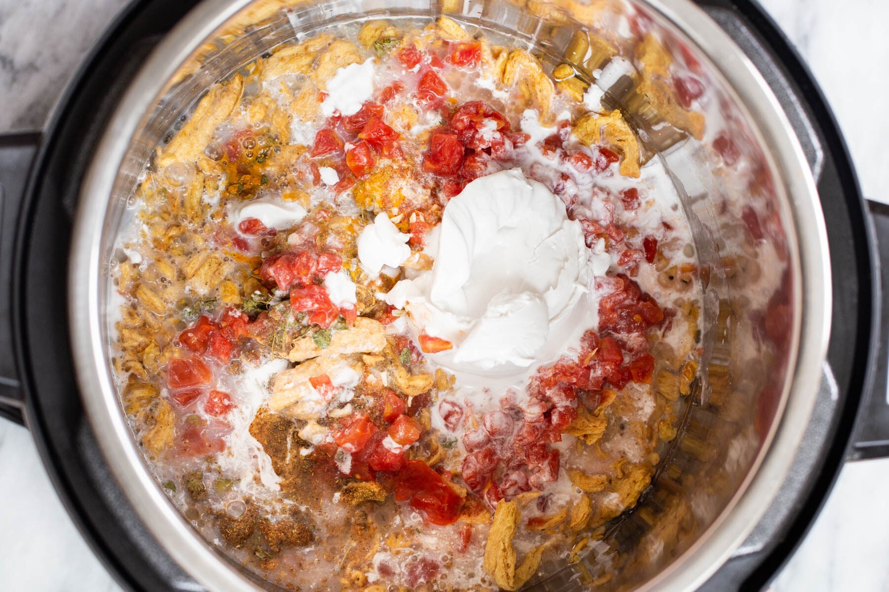 Instant Pot filled with curry ingredients