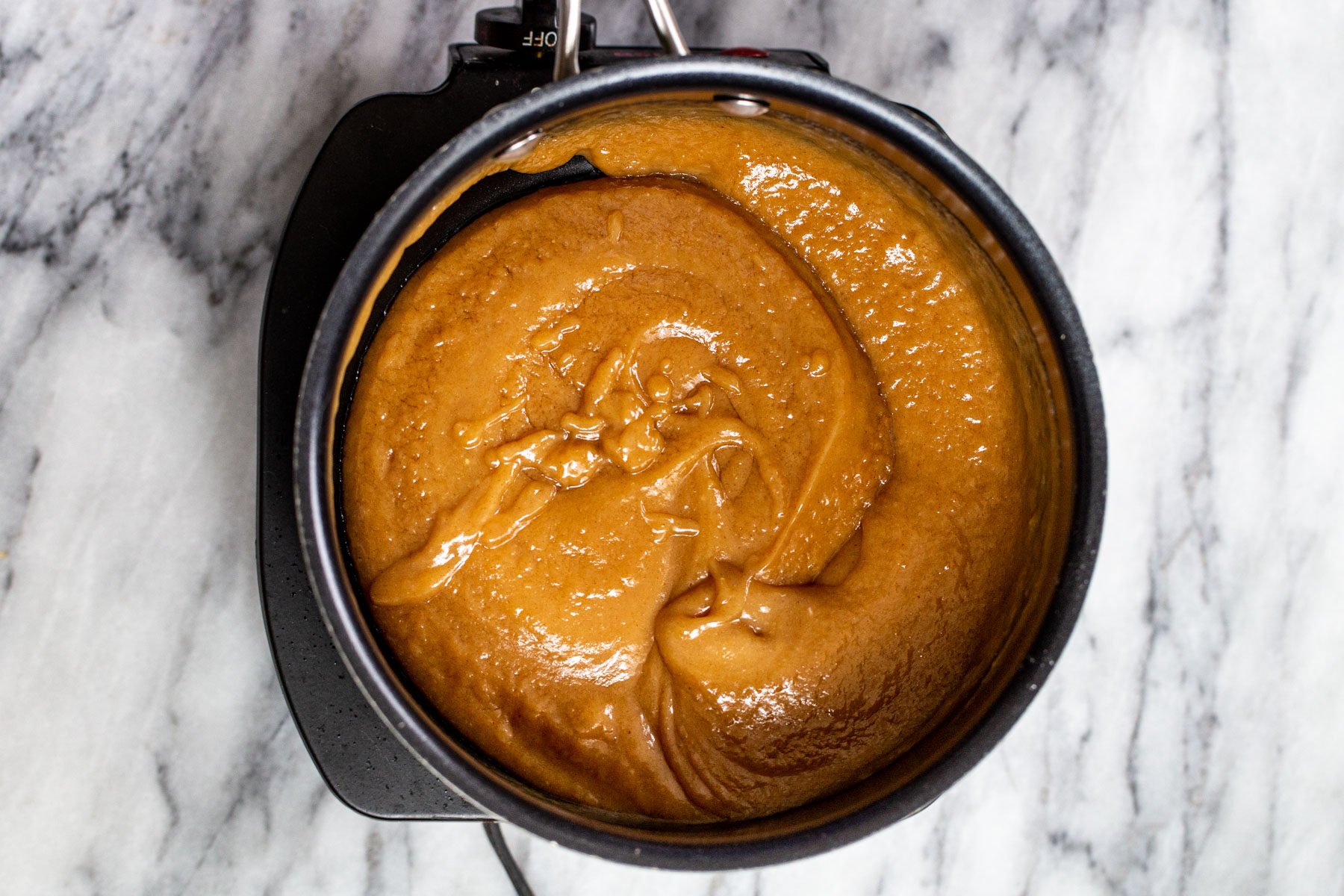 peanut butter filling for chocolate tarts in a saucepan 
