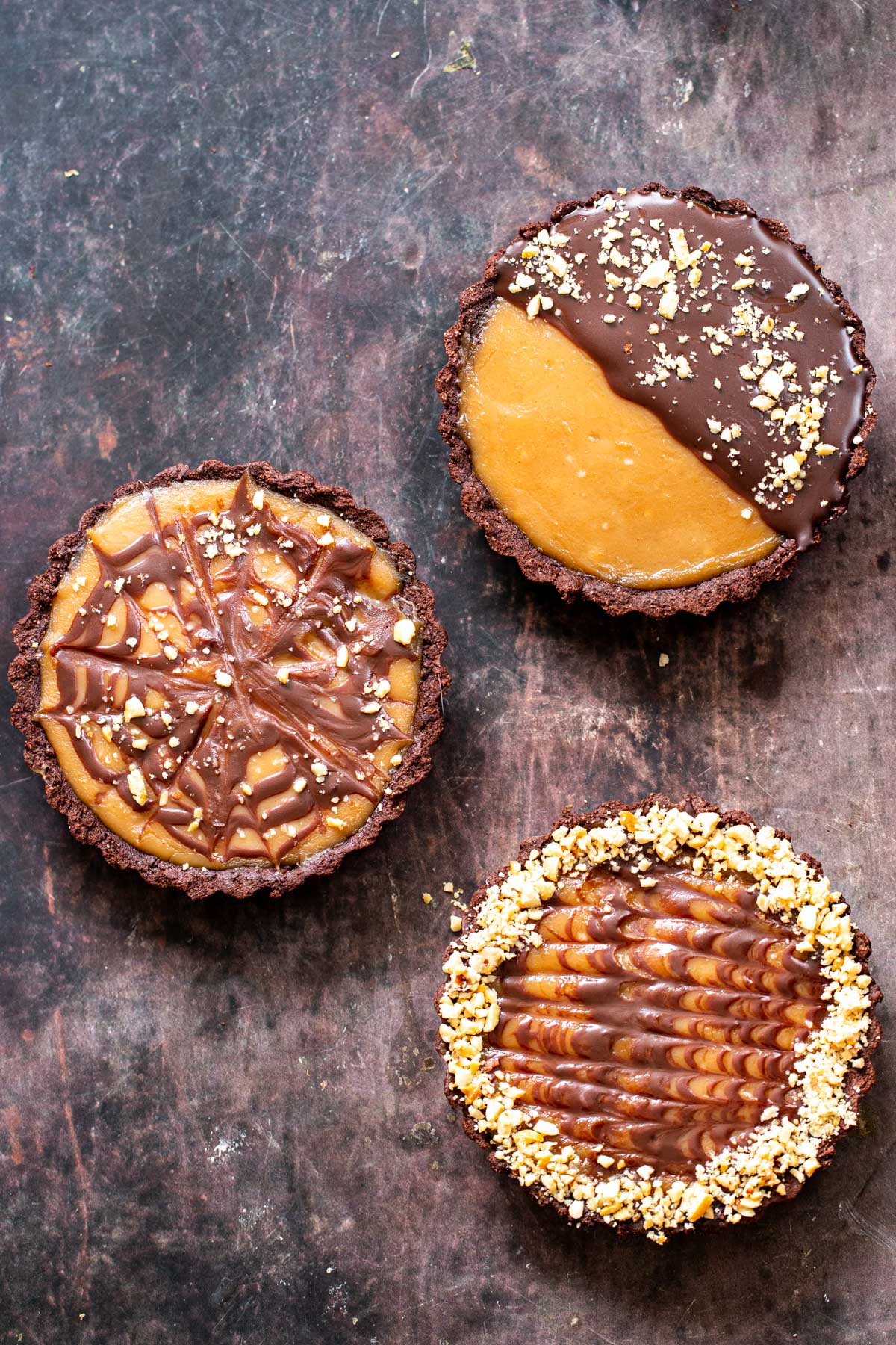 three peanut butter chocolate tarts