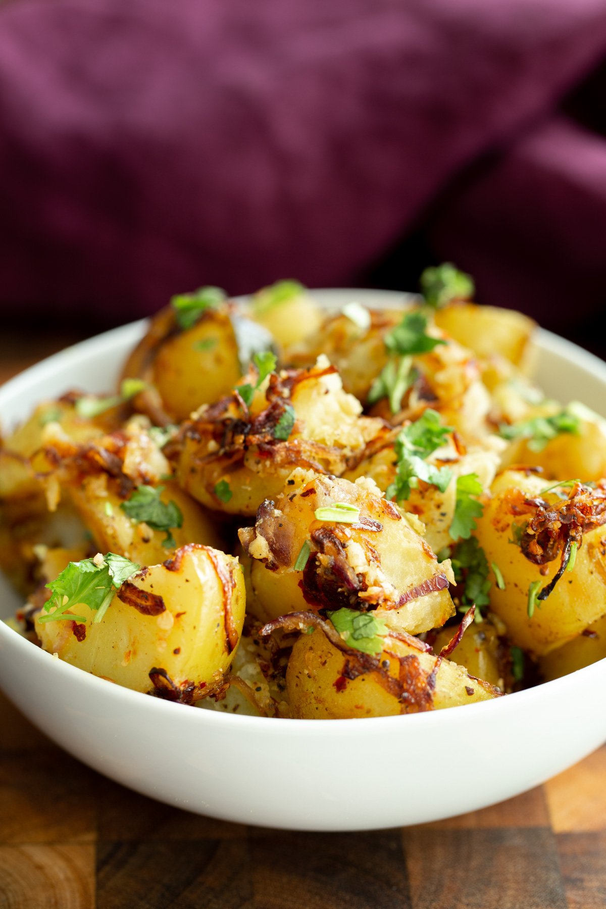 a plate with South Indian Potato Pepper Fry sprinkled with cilantro