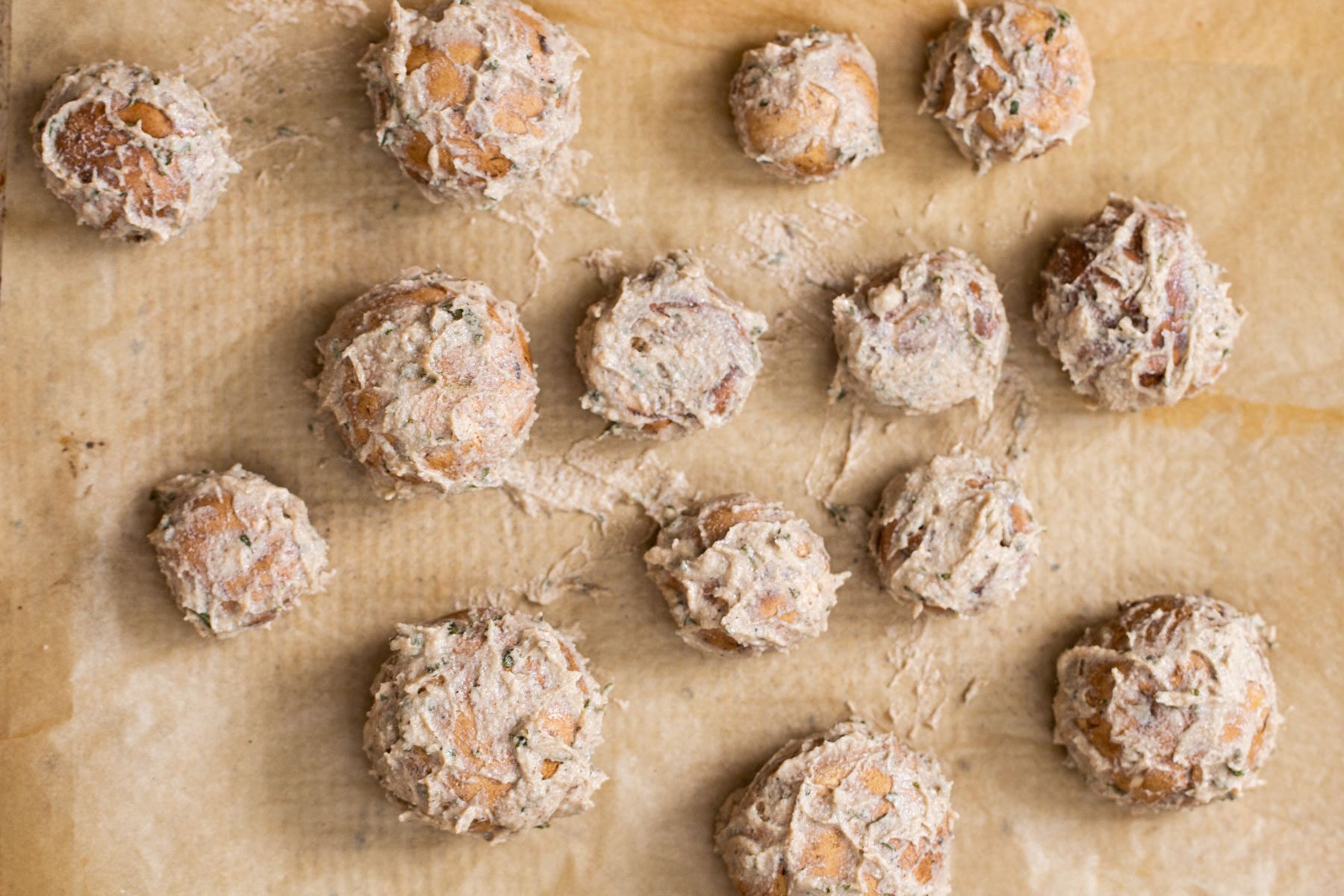 cremini mushrooms being baked on a sheetpan