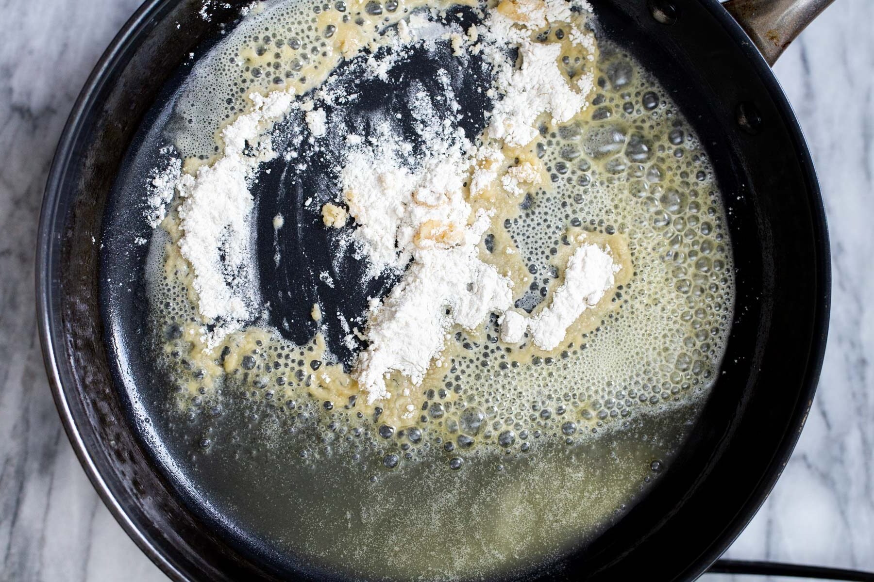 melted vegan butter and flour in a sauteeing pan