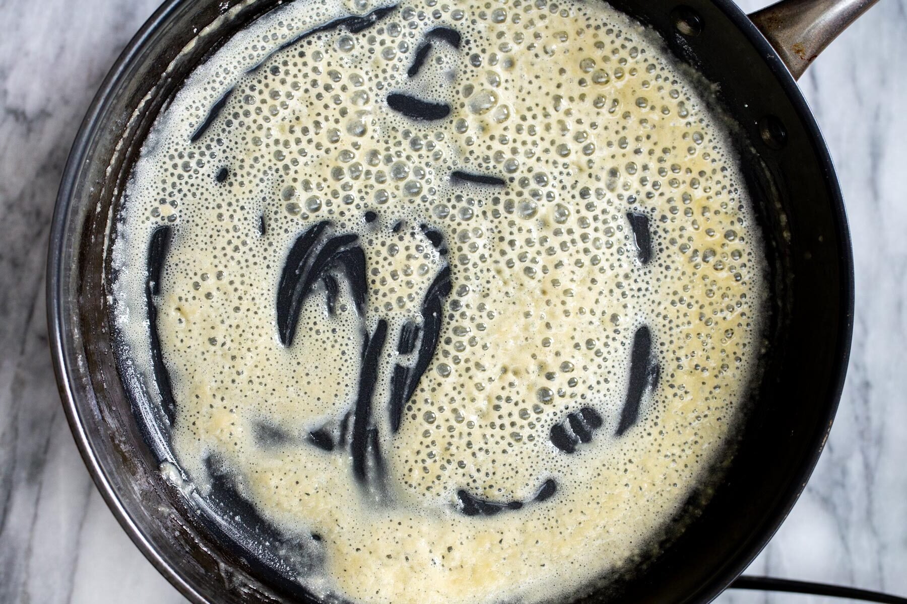 vegan roux in a black sauteeing pan