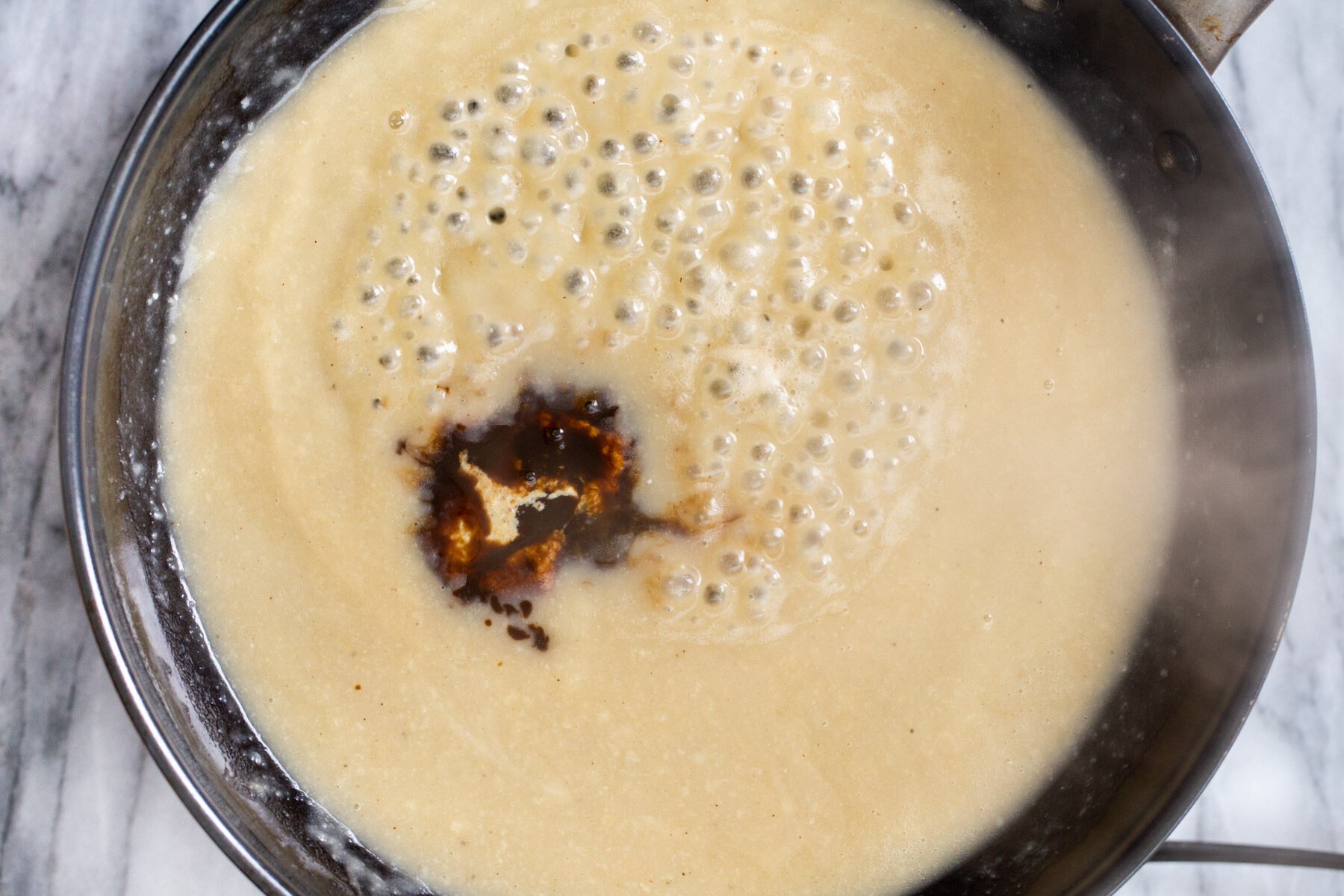 worcestershire sauce being added to vegan roux