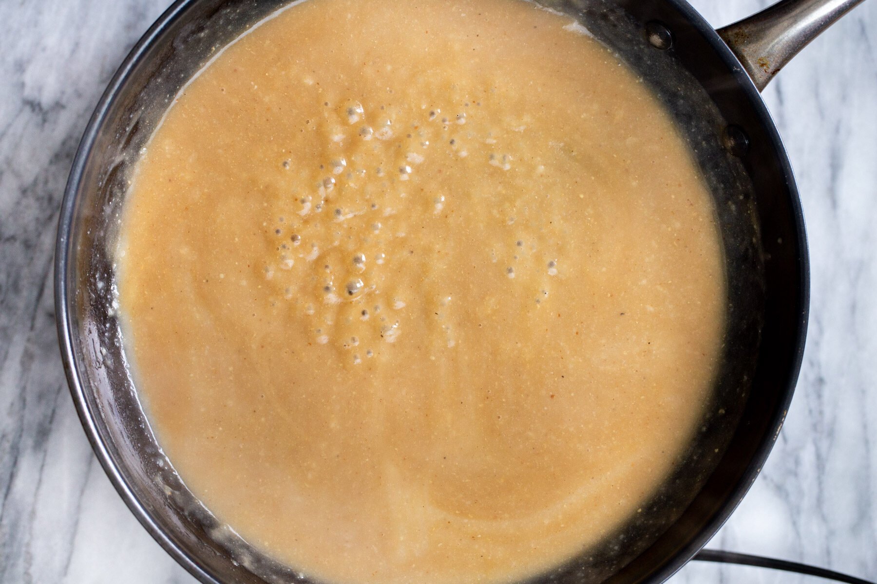 vegan mushroom gravy in a sauteeing pan