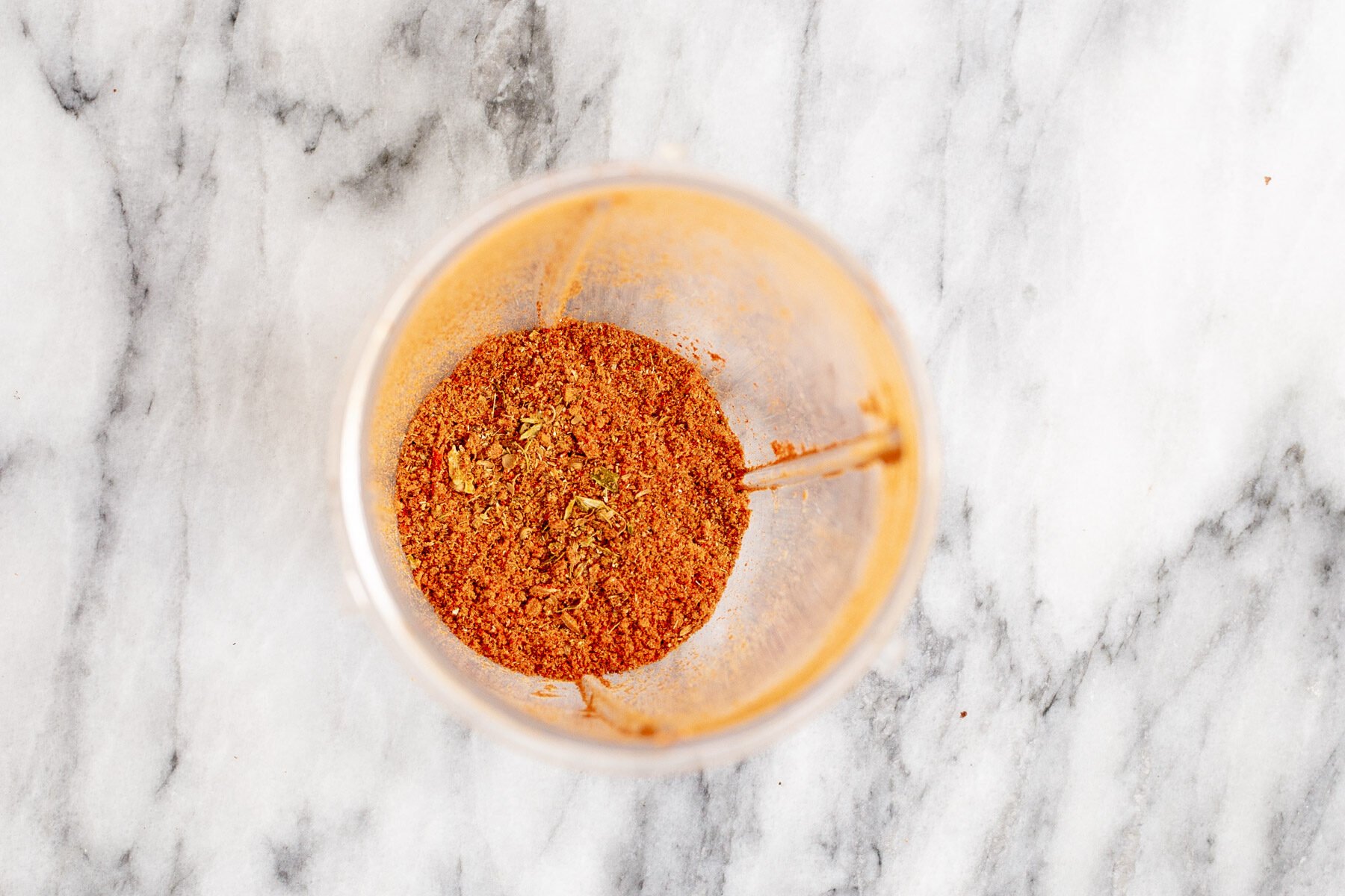 ground Indian spices on a marble countertop 