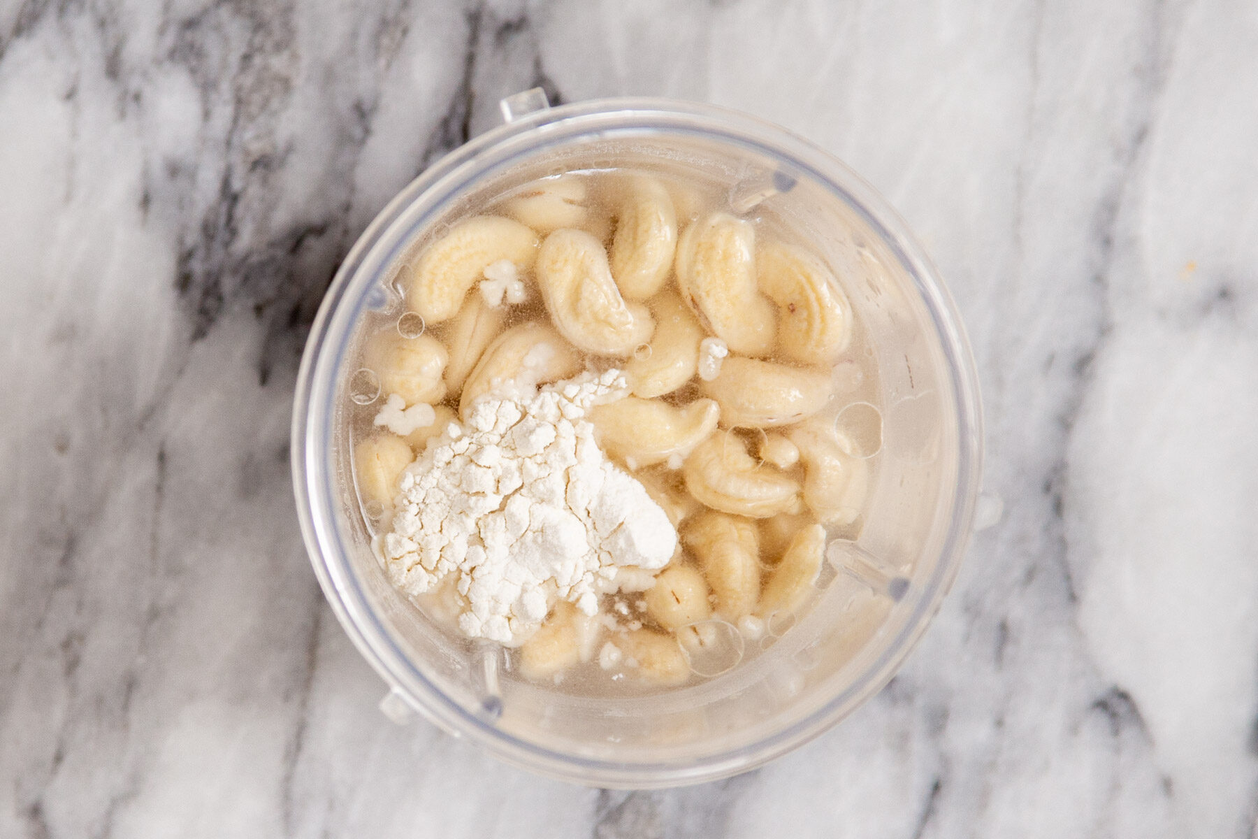 cashew custard ingredients in a small container ready to be blended