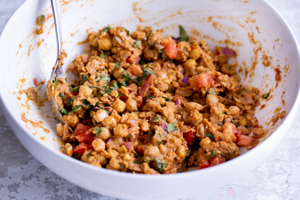 vegan chickpea salad in a white bowl