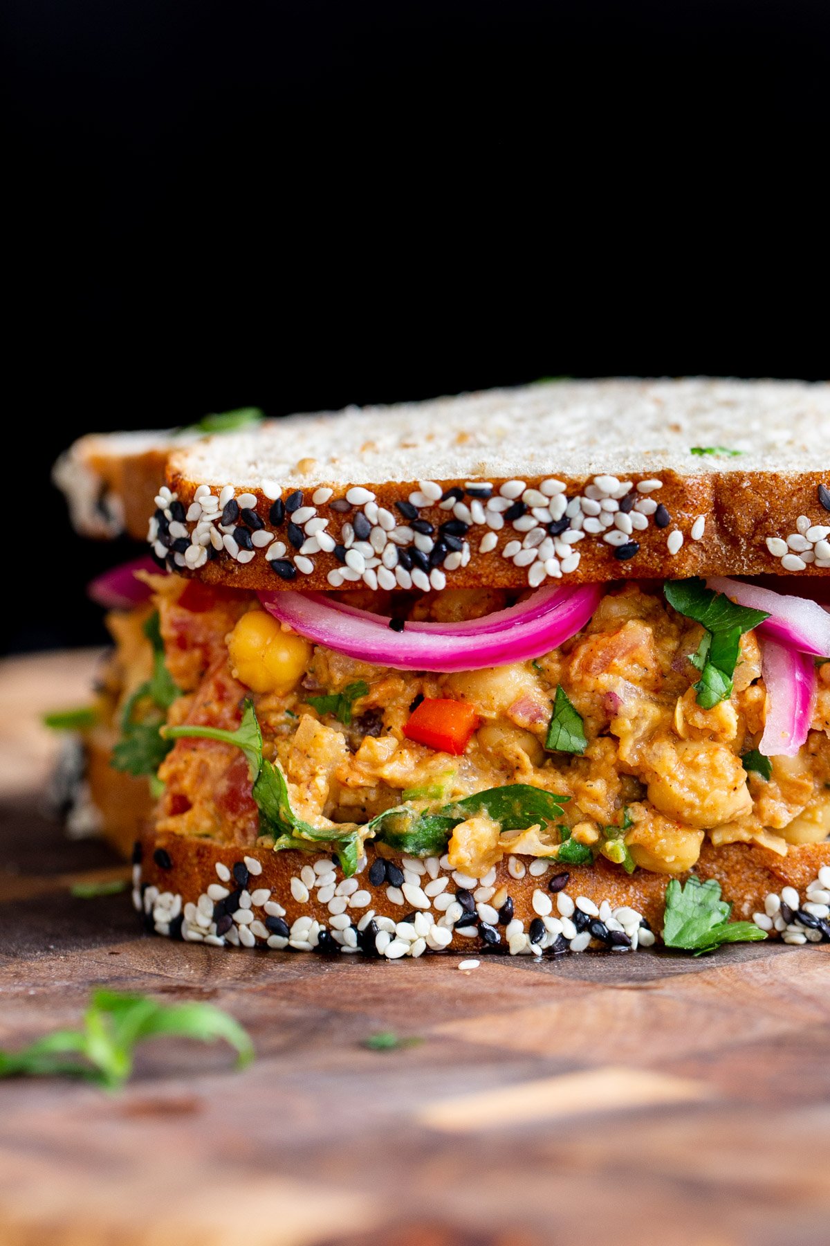 close up side view if a vegan lunch sandwich with vegan egg salad