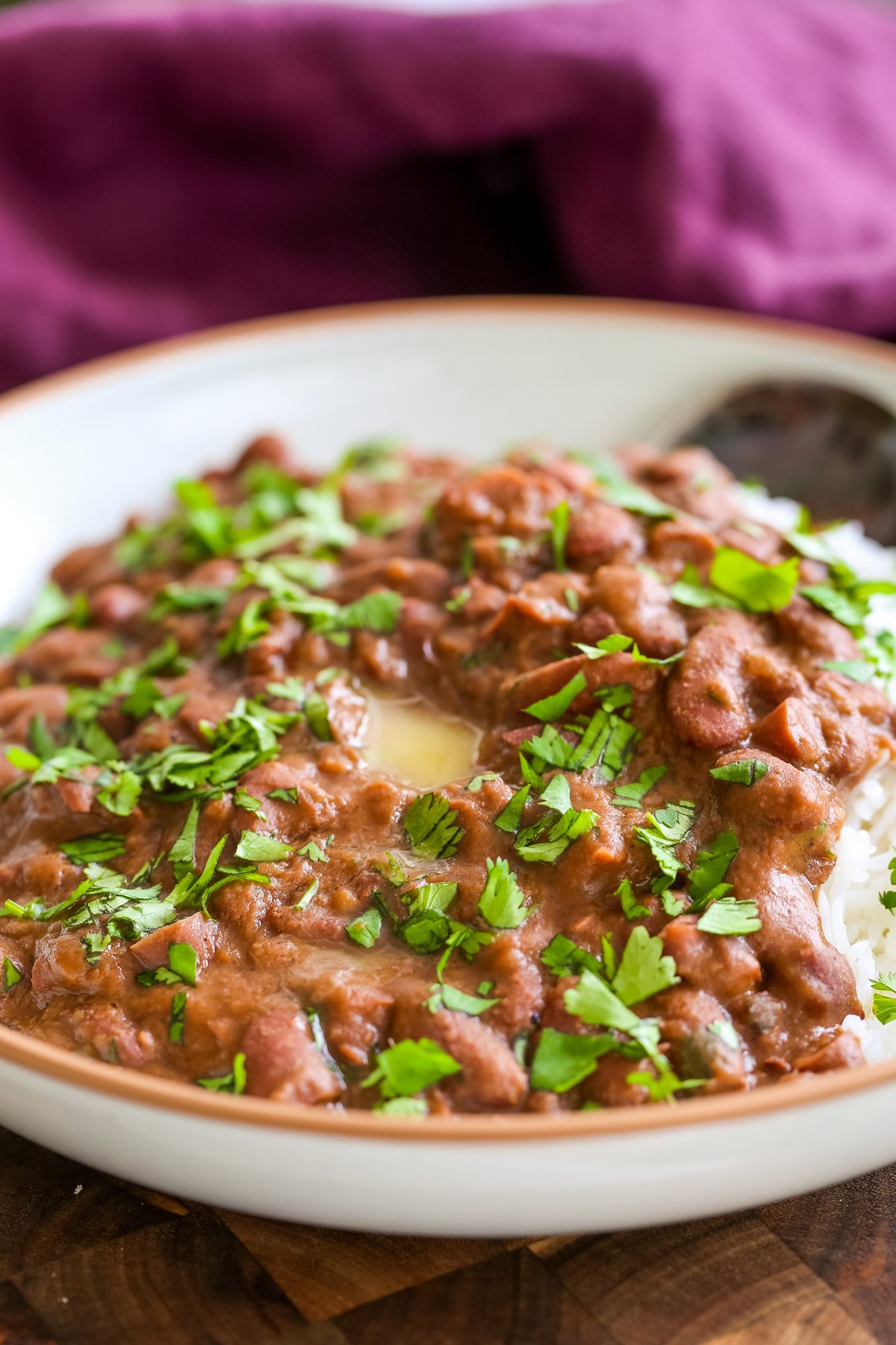 Dhaba Style Rajma Recipe  a plate of Dhaba Style Rajma with rice sprinkled with cilantro