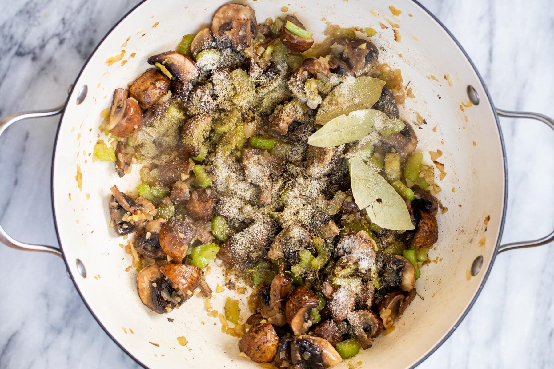 sauteed mushrooms, celery, onion and garlic in a pot