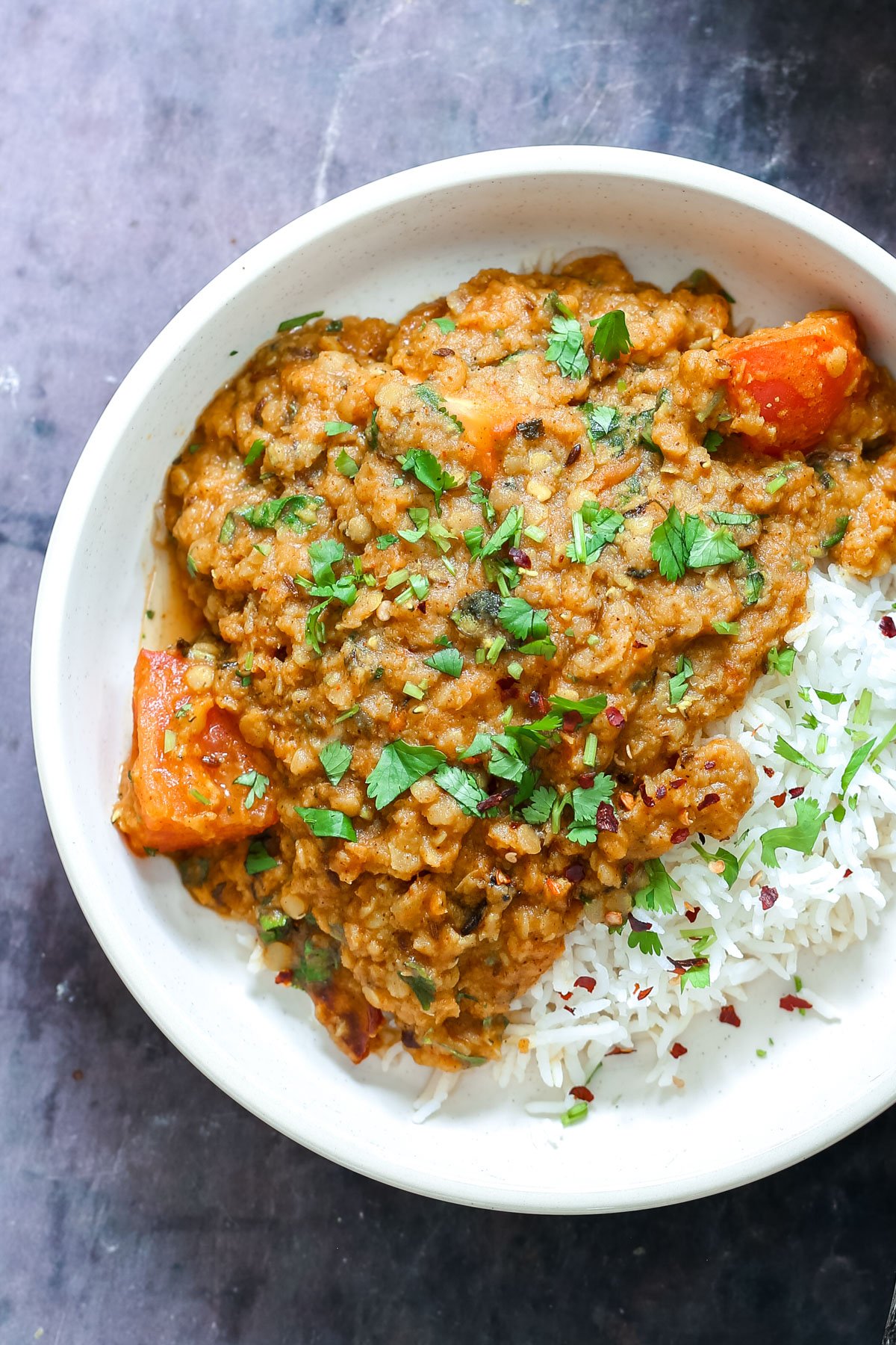 Indian butter daal served with rice on a plate