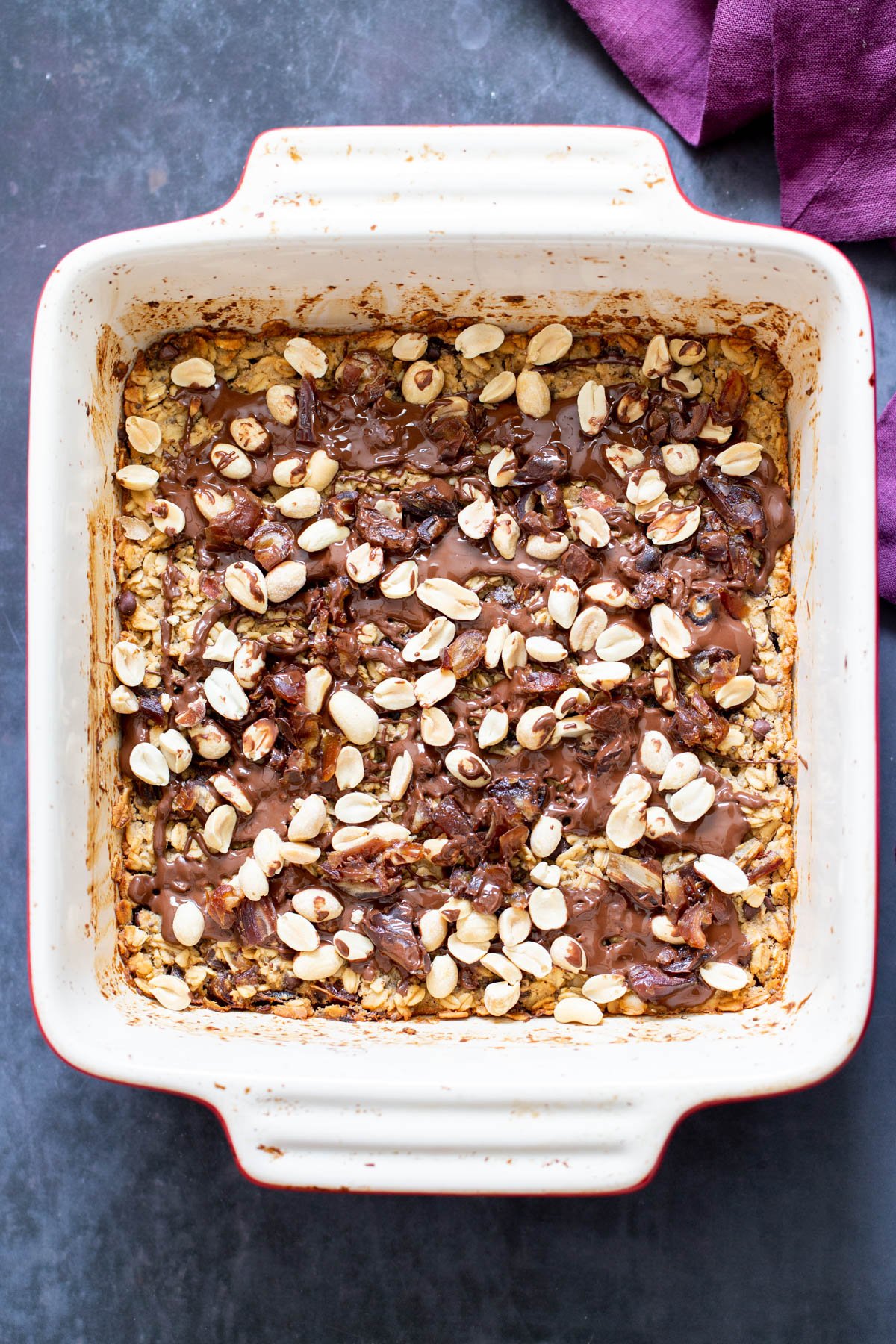 snickers baked oatmeal  a casserole dish with vegan snickers baked oatmeal