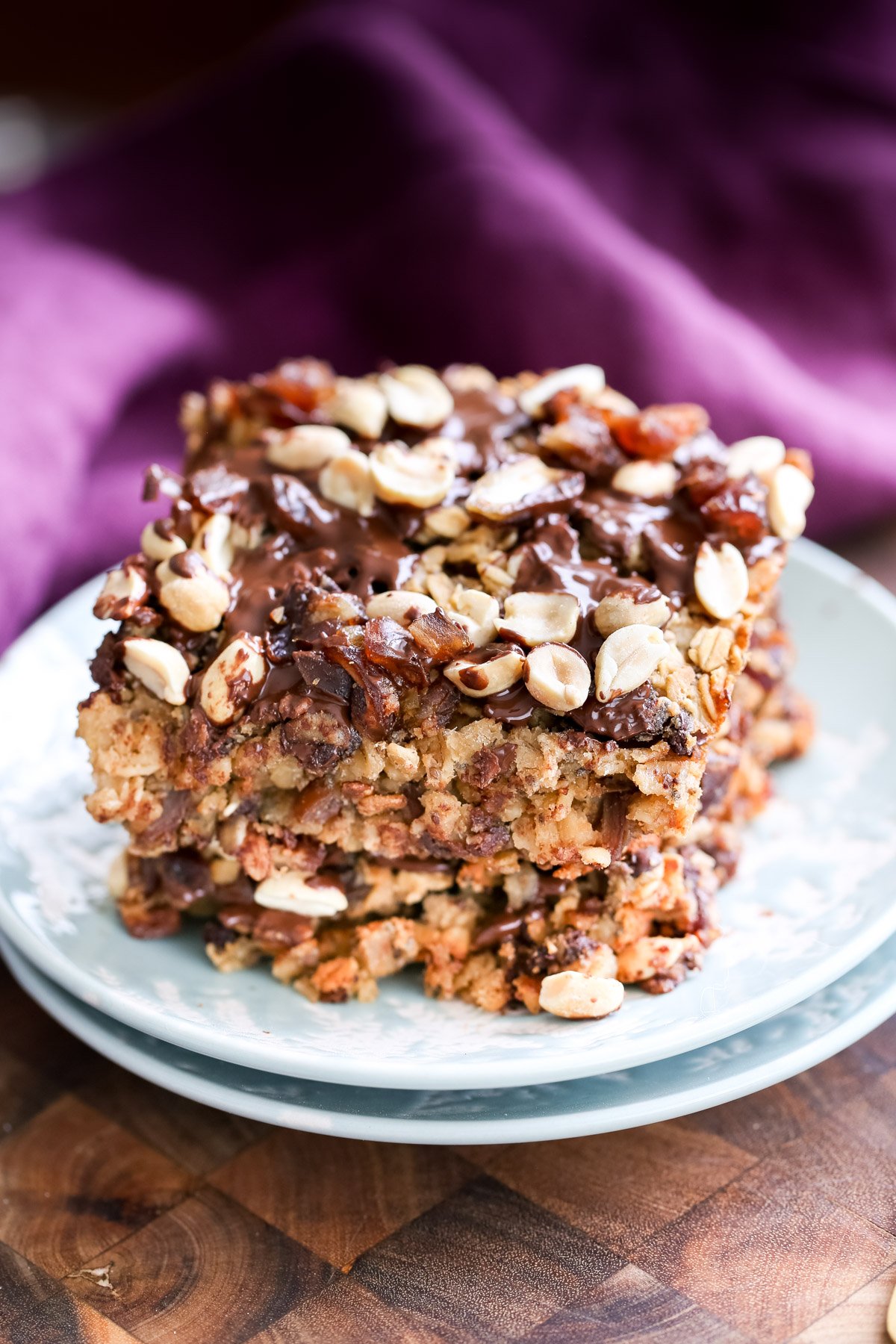 stacked squared of vegan snickers baked oatmeal