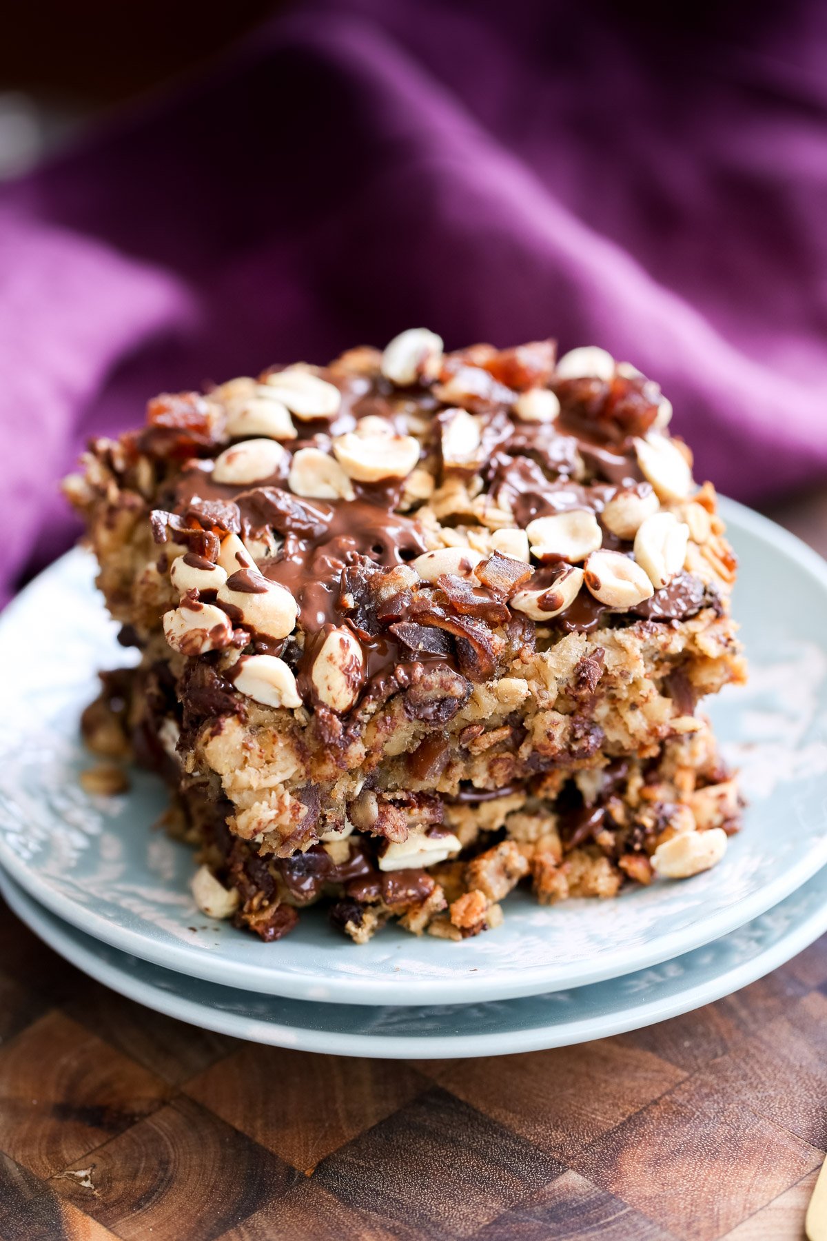 snickers baked oatmeal  two stacked squares of vegan snickers baked oatmeal
