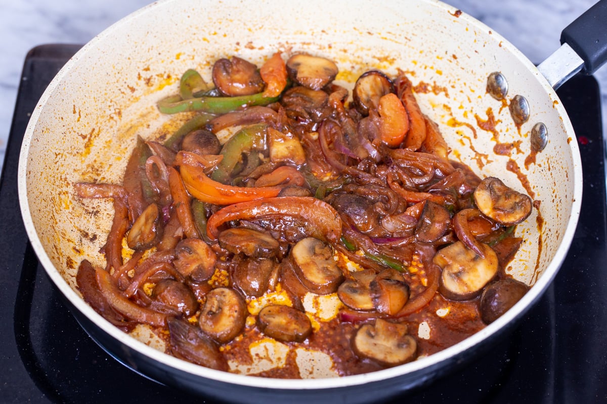 vegan birria tacos filling in a sauteeing pan