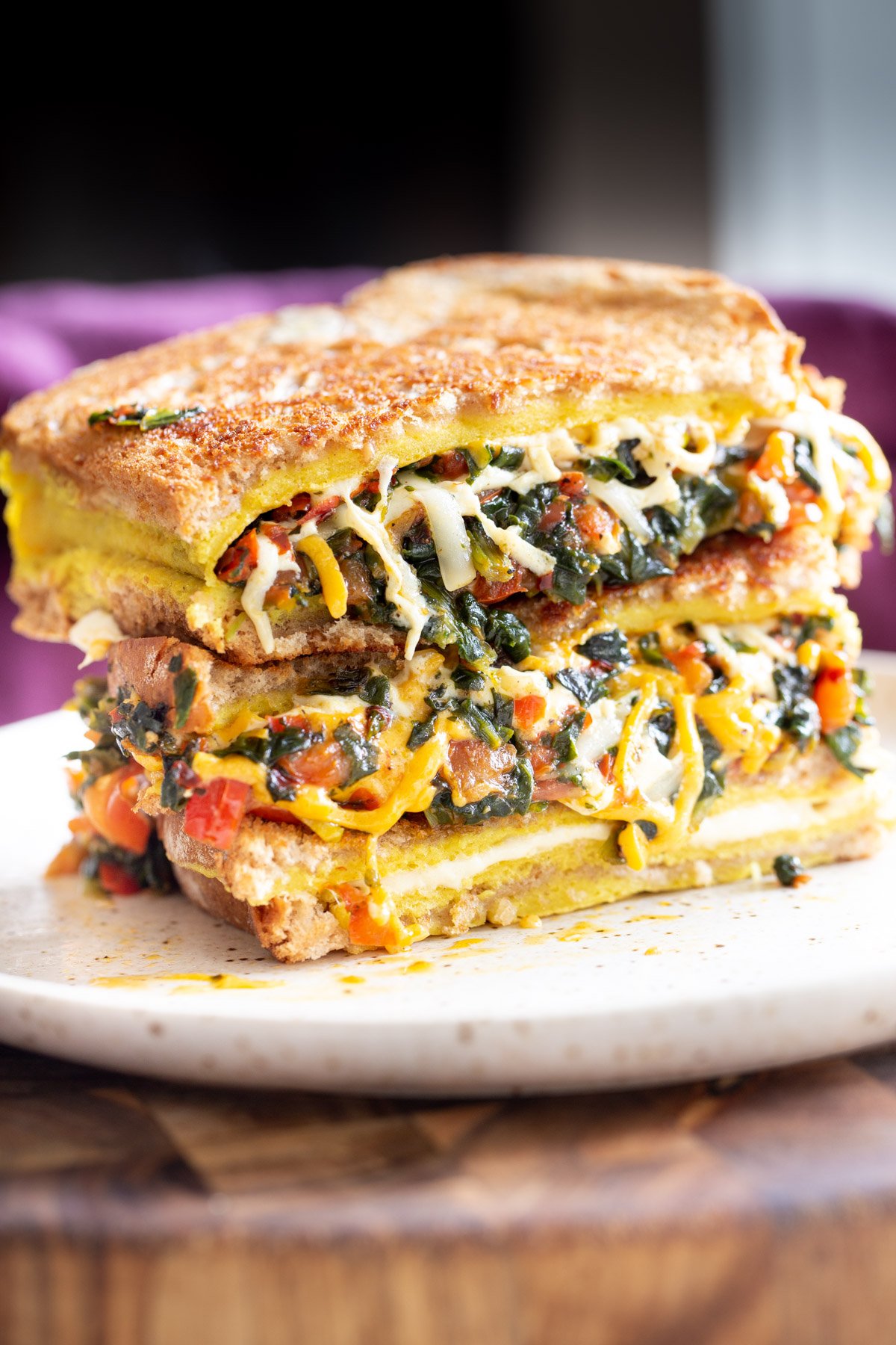 stacked vegan moong egg sandwich on a plate