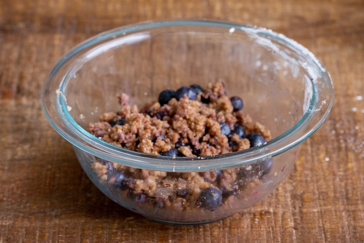 blueberry streusel dough in a glass bowl