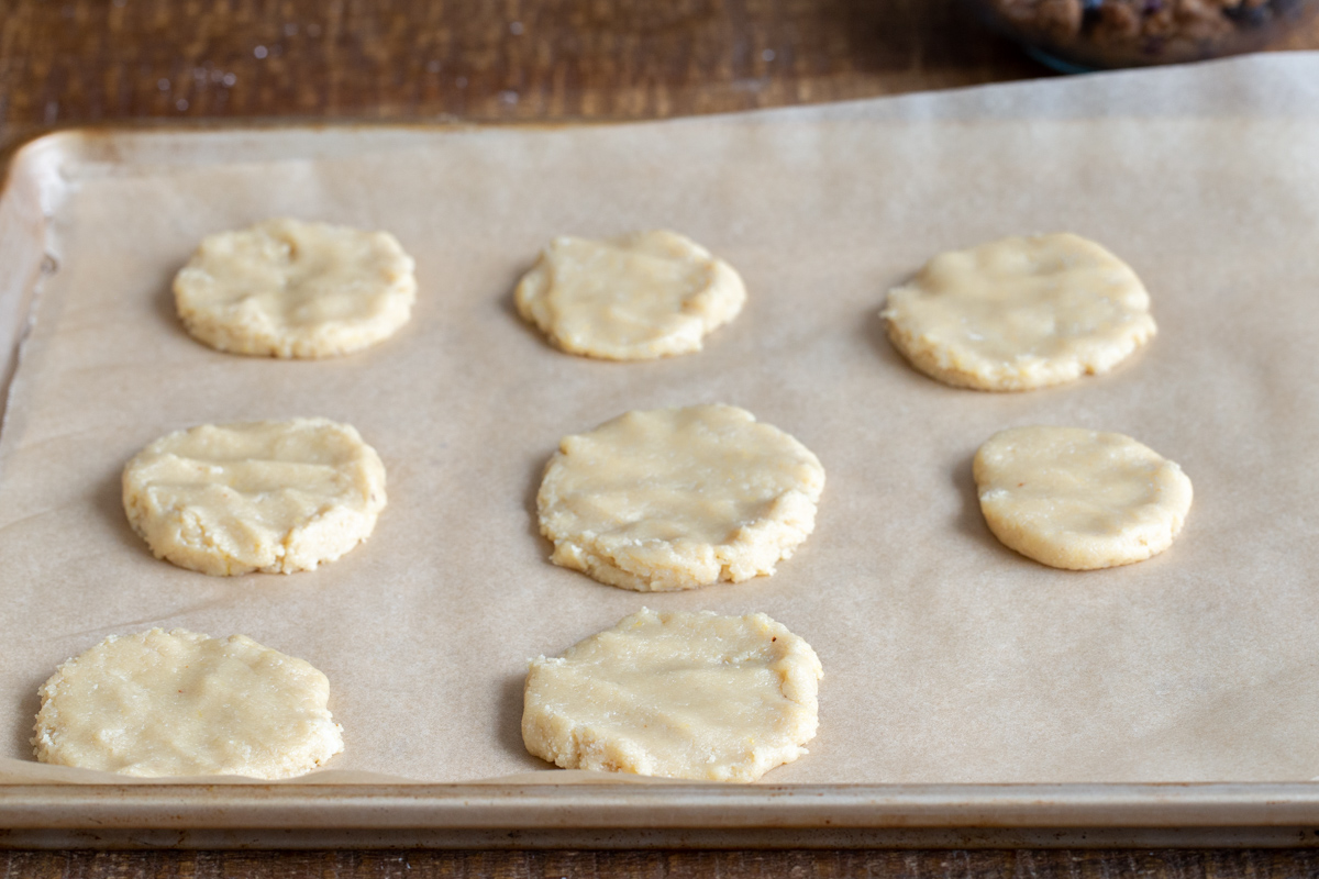 vegan almond flour cookie dough on a lined baking sheet