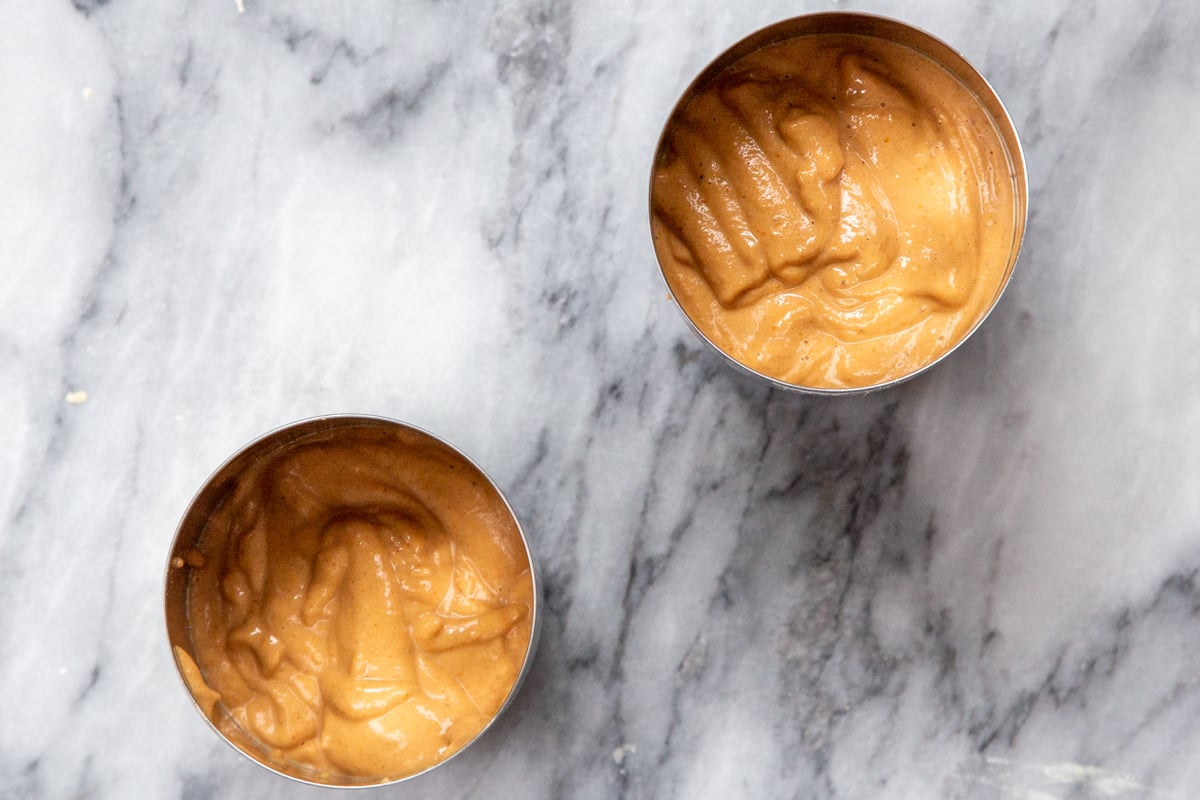 vegan pepperoni sausage batter being filled into cans