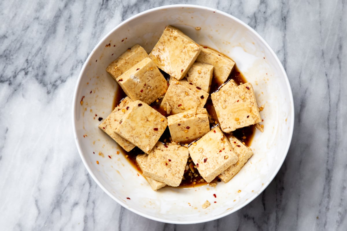slices of pressed marinated tofu in a small bowl
