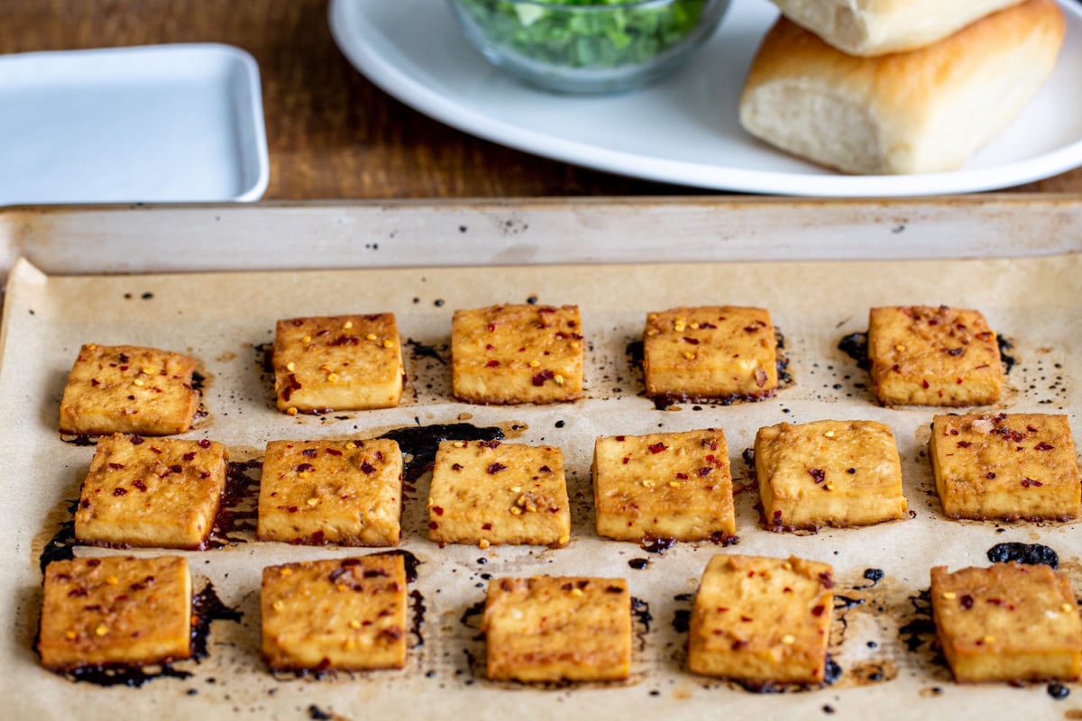 baked marinated chili garlic tofu on a sheetpan