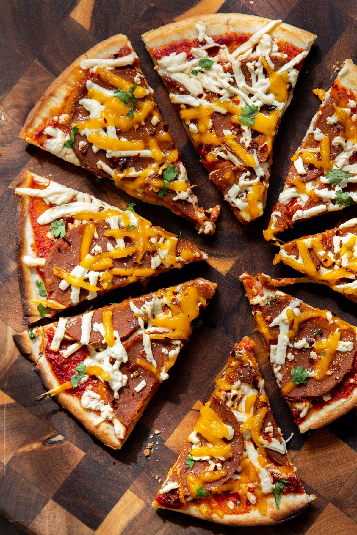 sliced vegan pepperoni pizza made with grainfree crust