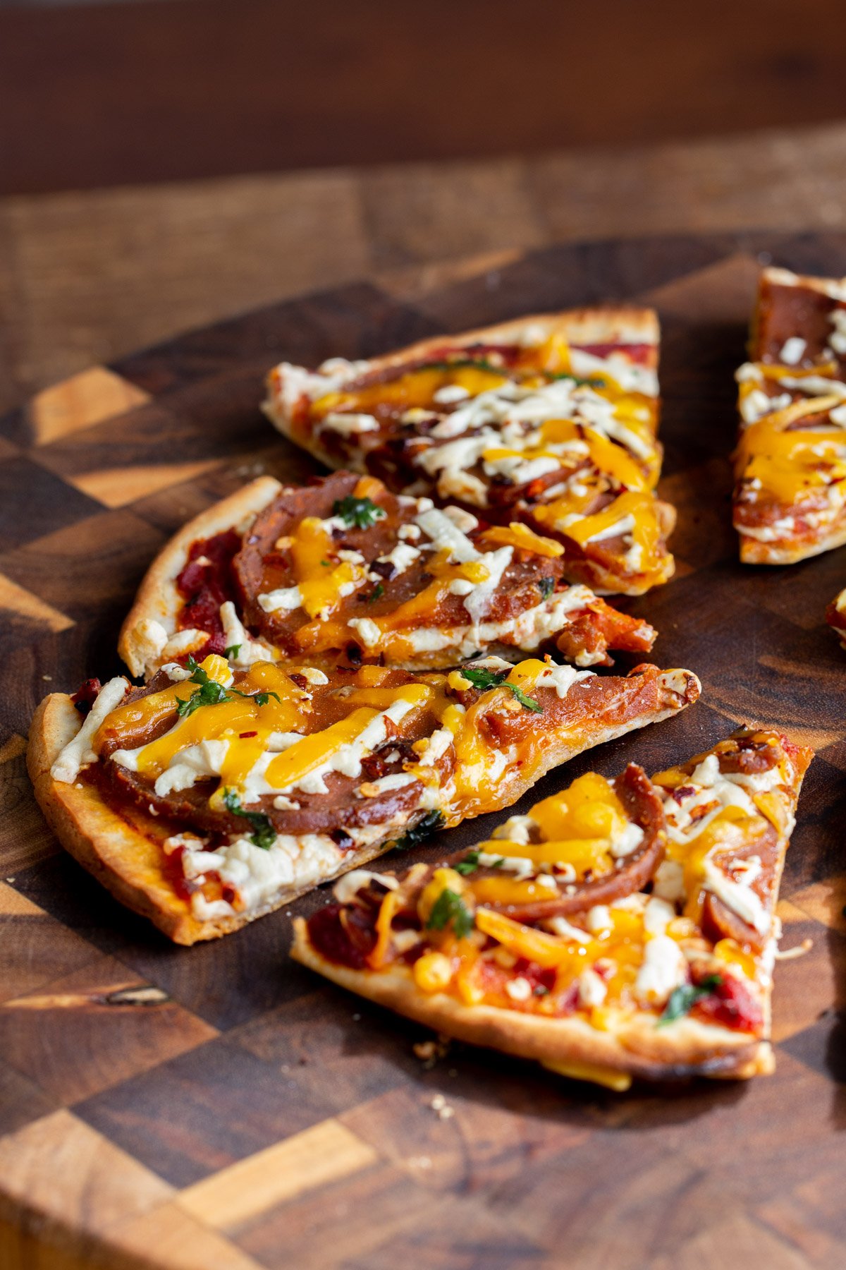 side view of sliced vegan almond flour pepperoni pizza