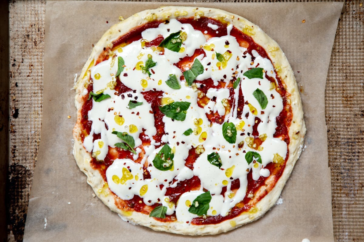 overhead shot of vegan mozzarella pizza ready to be baked